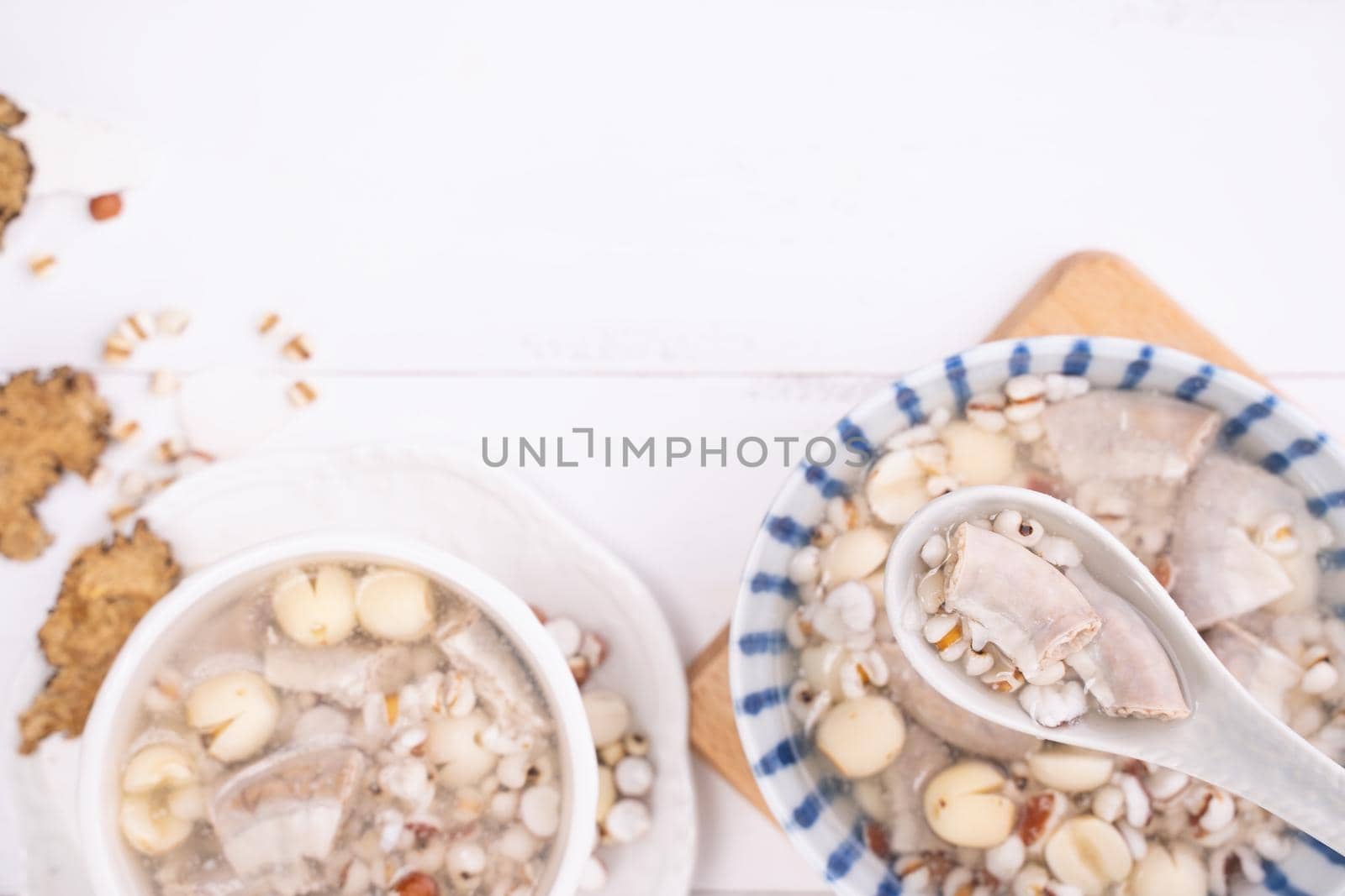 Tasty Four Tonics Herb Flavor Soup,Taiwanese traditional food with herbs,pork intestines on white wooden table,close up,flat lay,top view