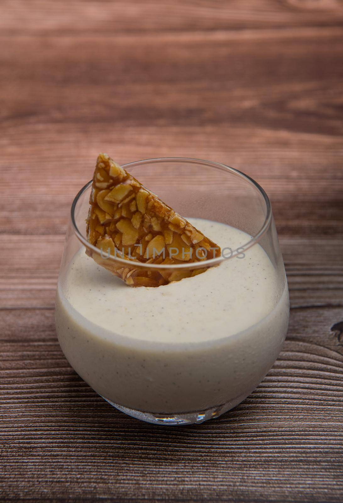 Bavarian recipe with pear and vanilla served with almond nougatine. High quality photo