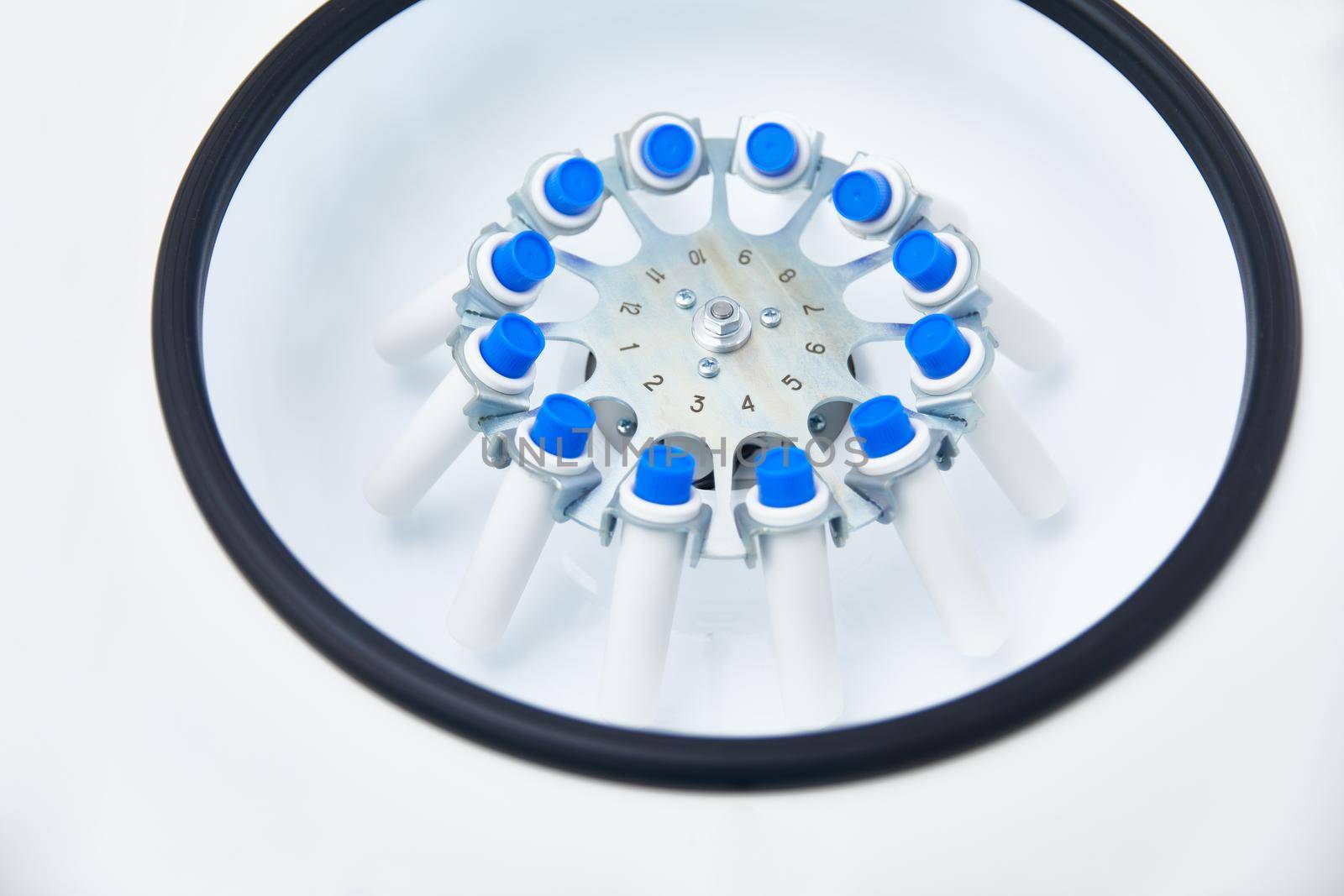 Blood test tubes in centrifuge. Plasma preparation in medical.