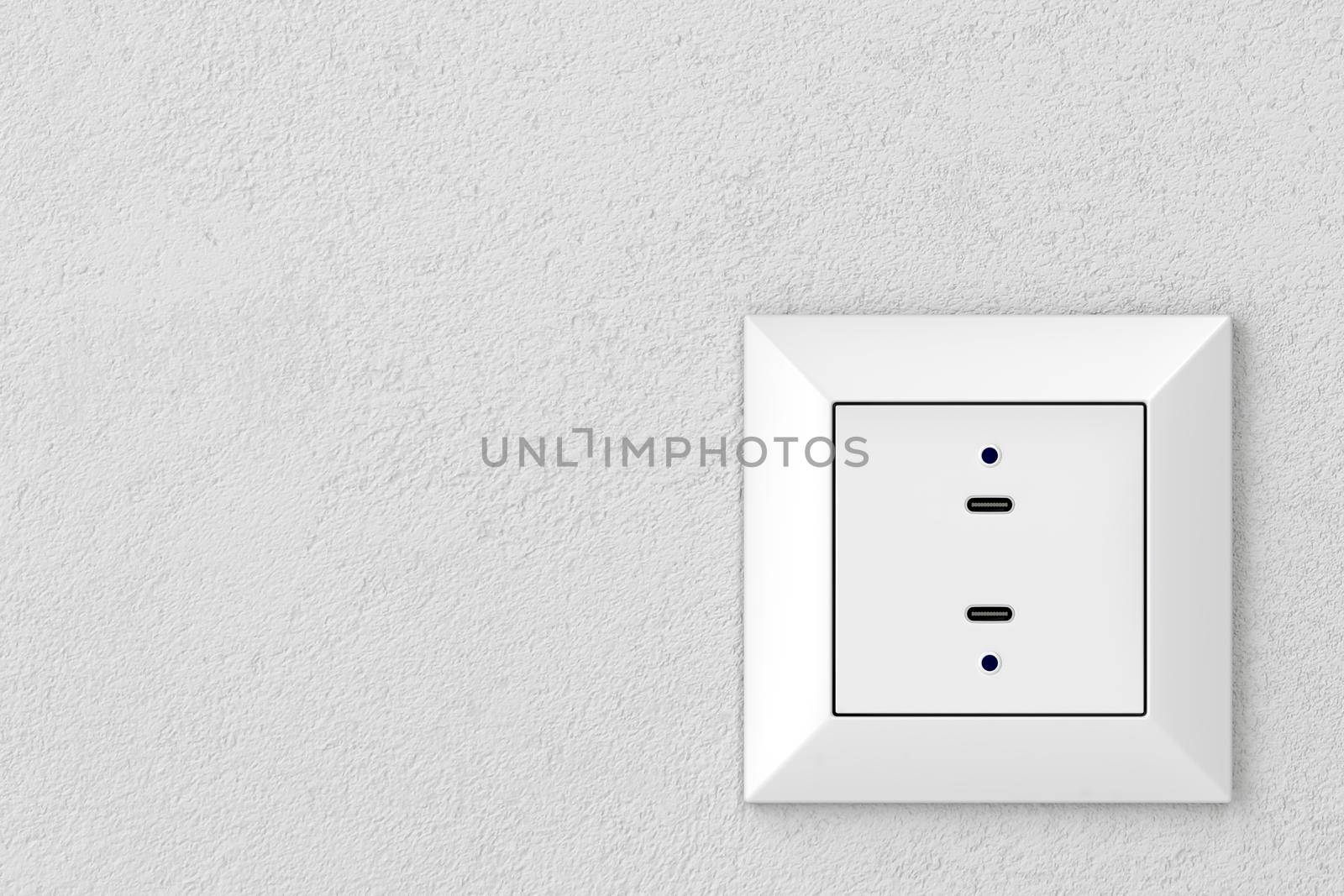 Wall socket with two USB-C ports for charging various types of electronic devices