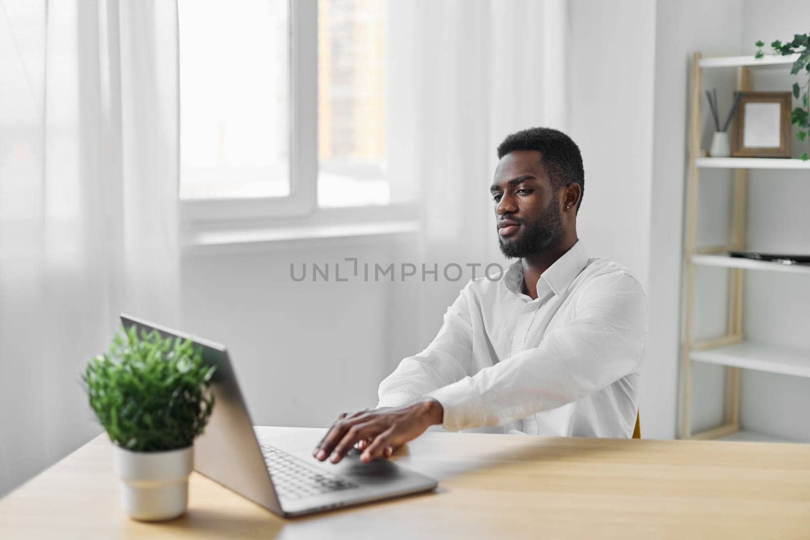 african man american education job laptop online office freelancer computer student worker by SHOTPRIME