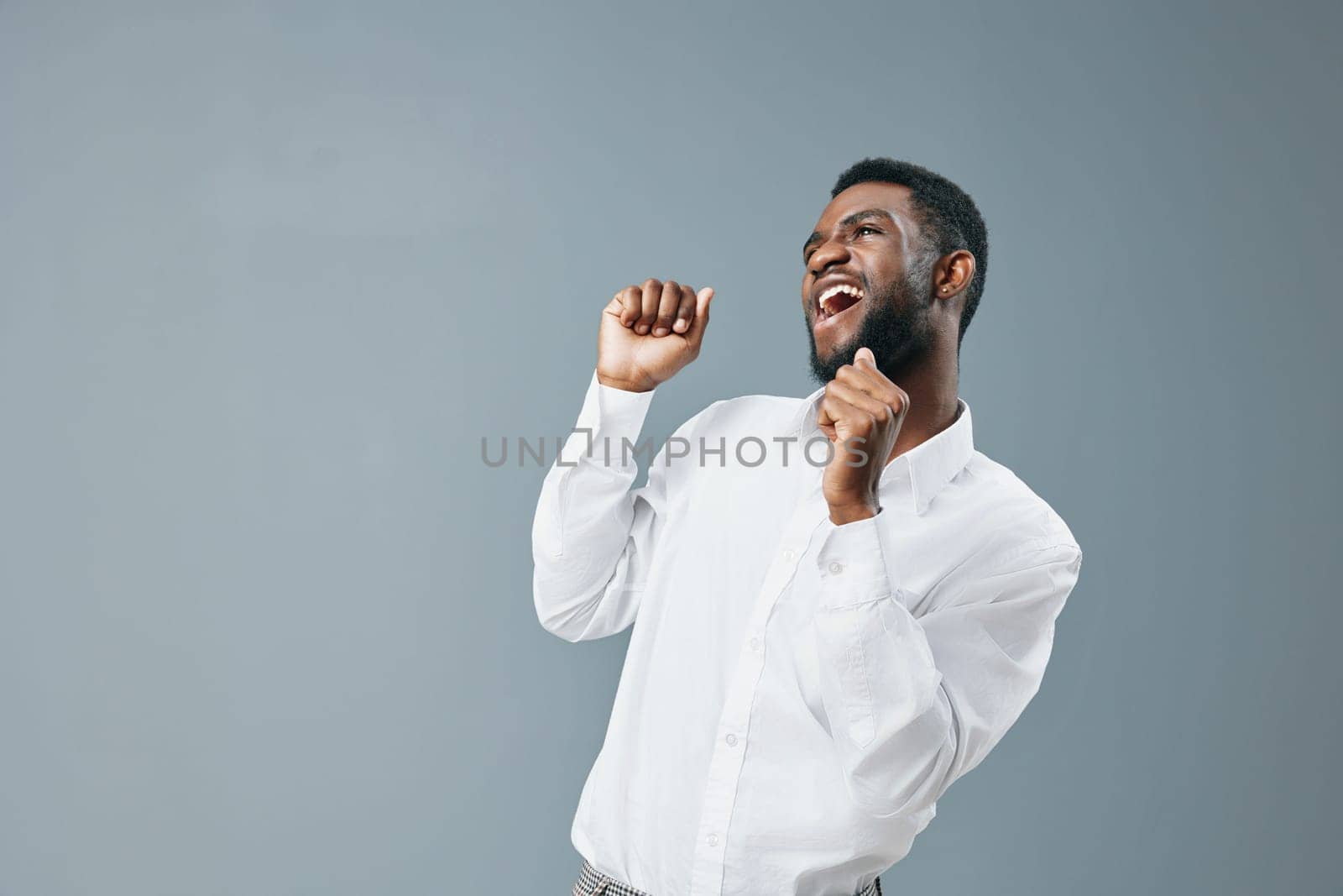 man american copy happy african standing smile white space studio shirt advertising young by SHOTPRIME