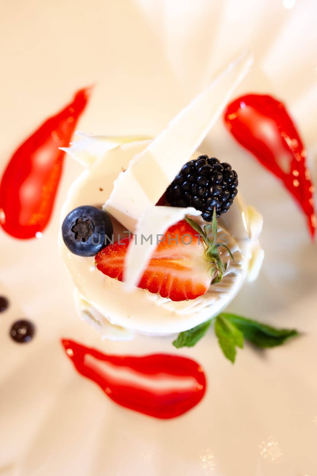 top view creative serving of coke mousse dessert in a restaurant close-up by Pukhovskiy