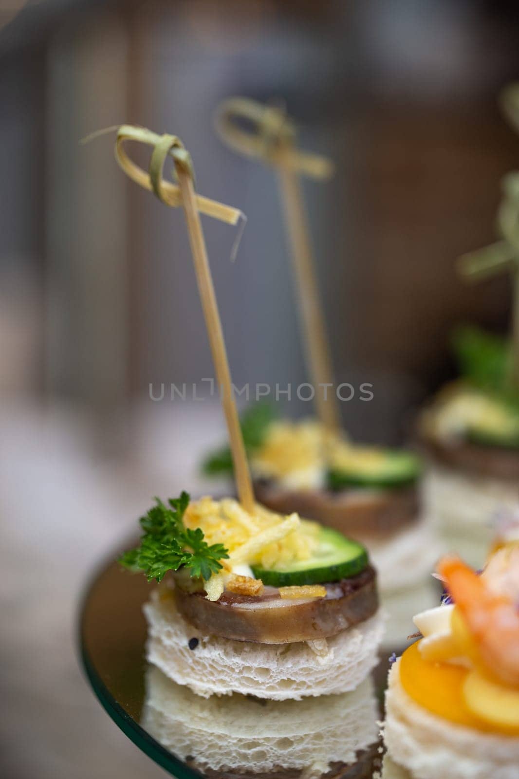 close-up sandwich with a piece of white bread and horse sausage and cucumber by Pukhovskiy