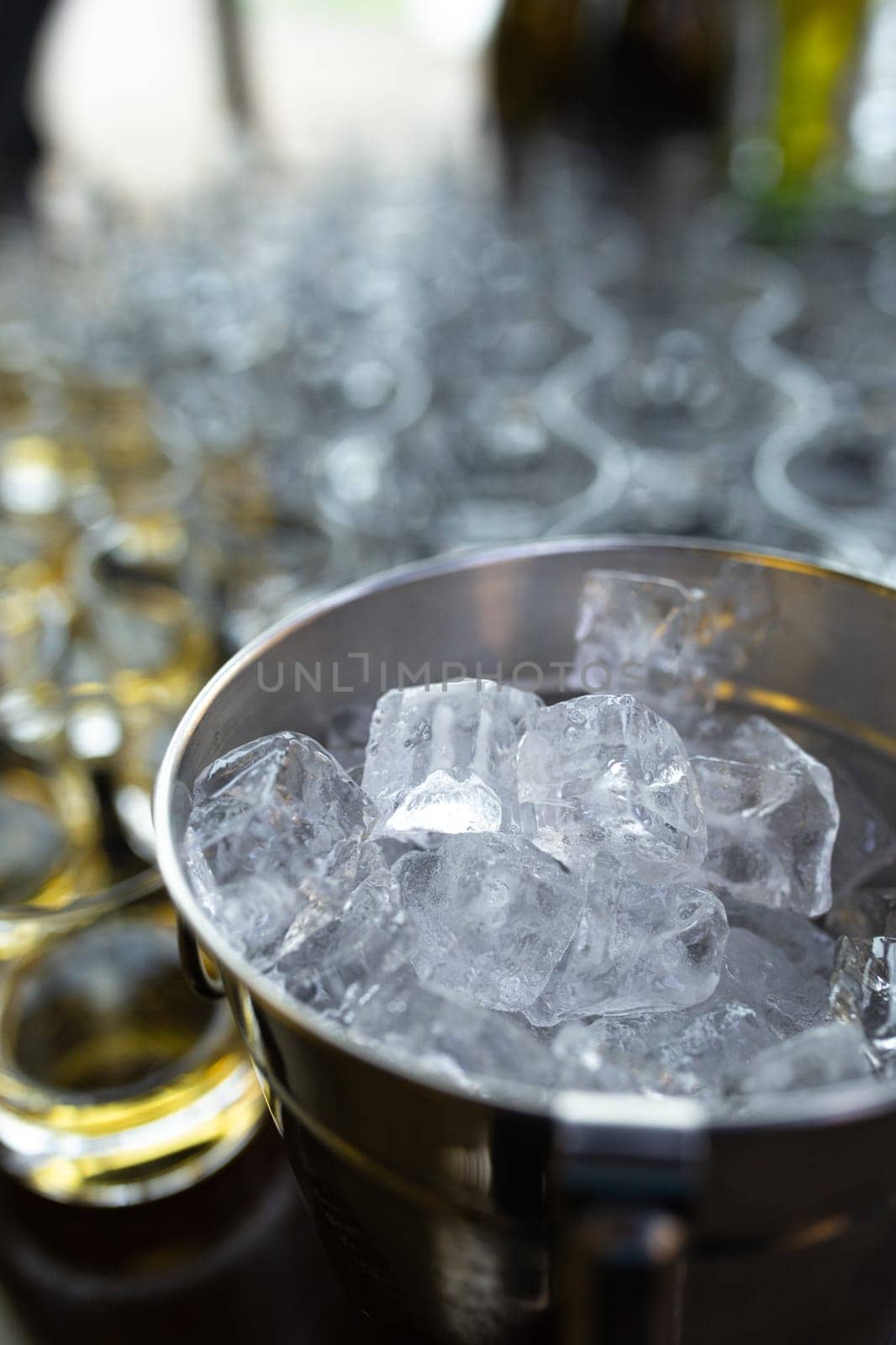 close-up of a metal ice bucket for cooling drinks by Pukhovskiy