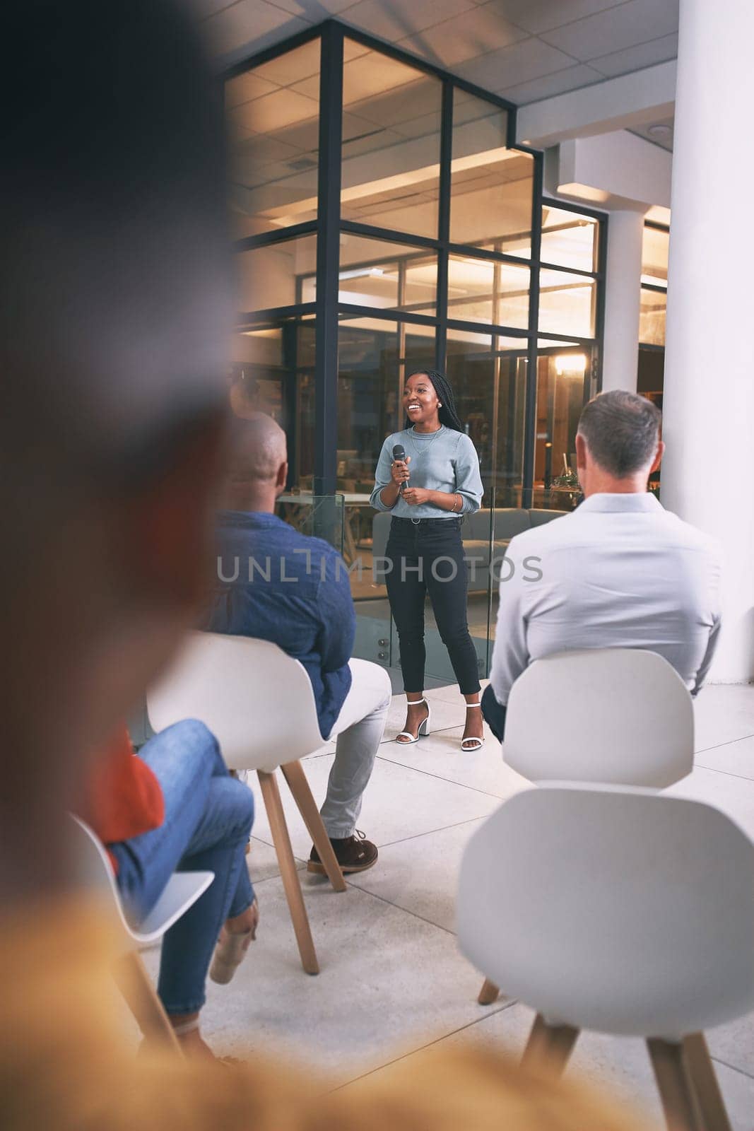 Public speaking is her favourite thing. a young businesswoman talking during a conference at work. by YuriArcurs