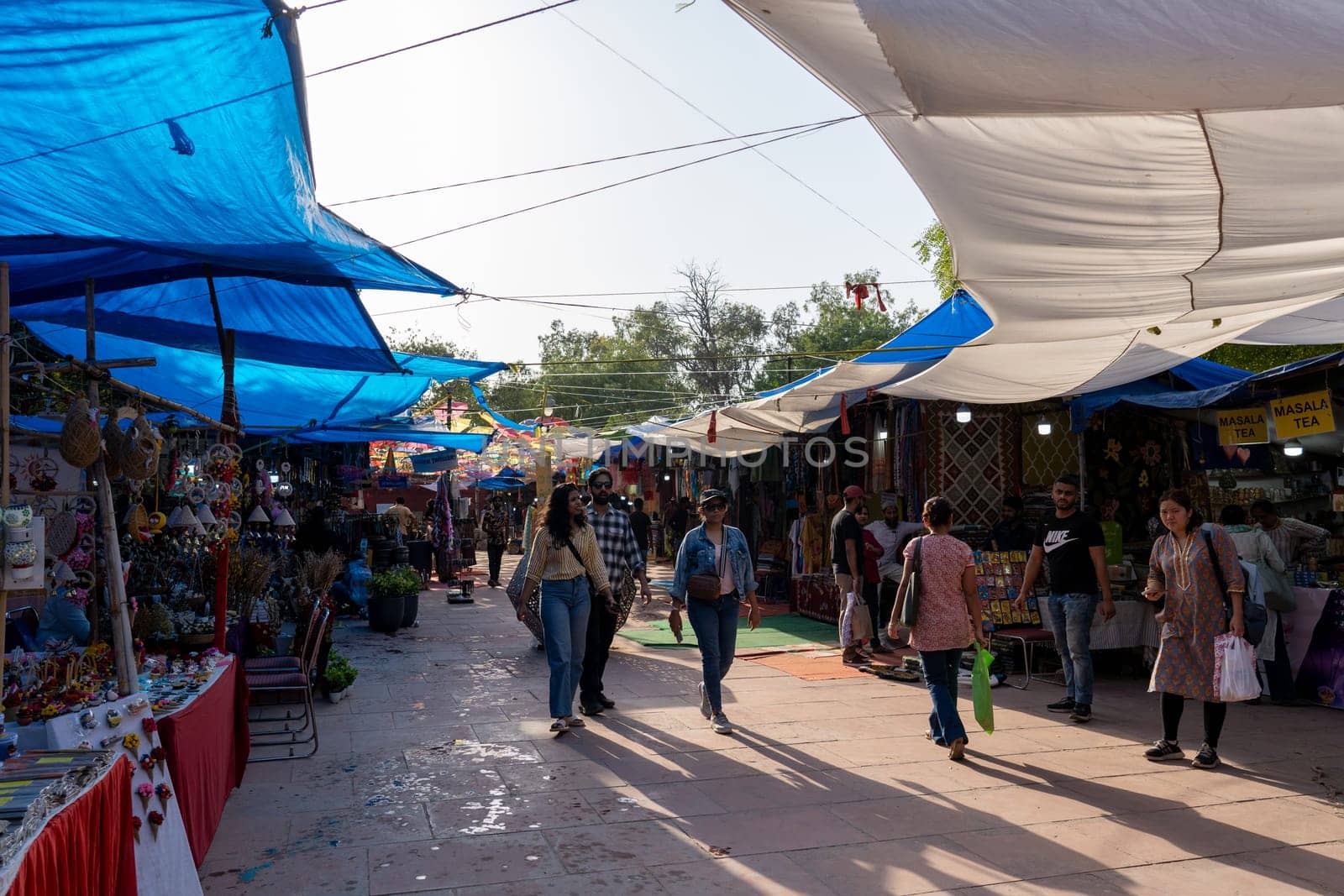 New Delhi, India - April 11, 2023: People at the popular Dilli Haat Food and Craft Bazar.