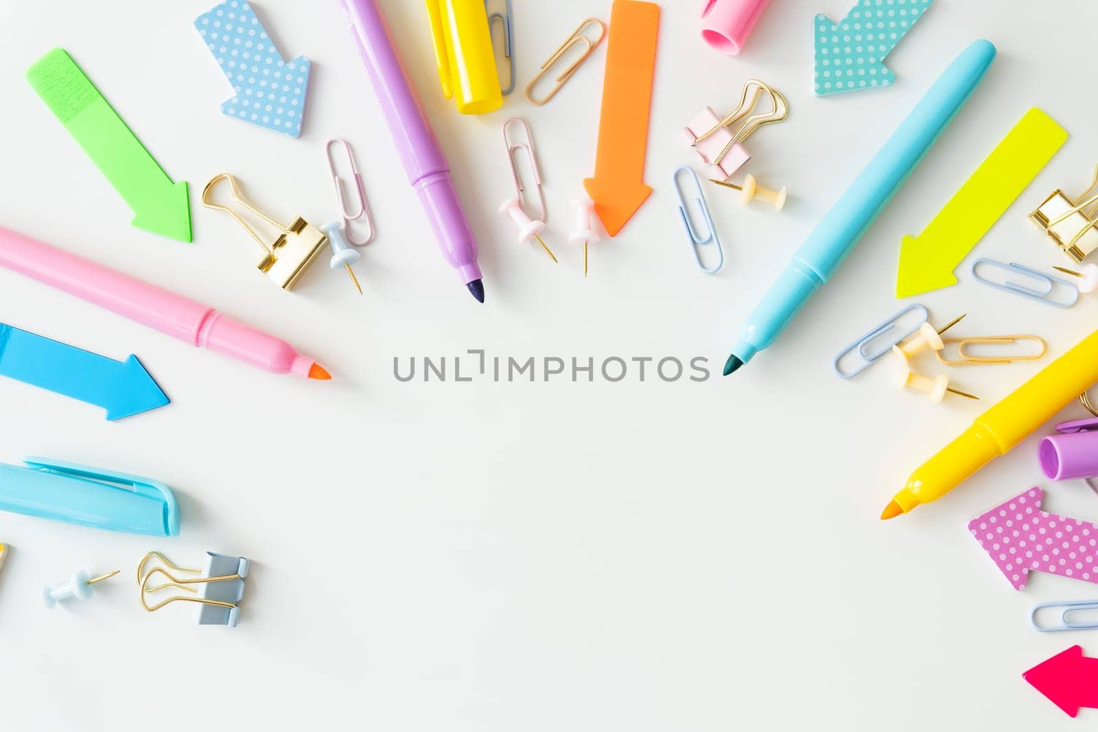 Stationery, school supplies on a white table in bright pastel colors