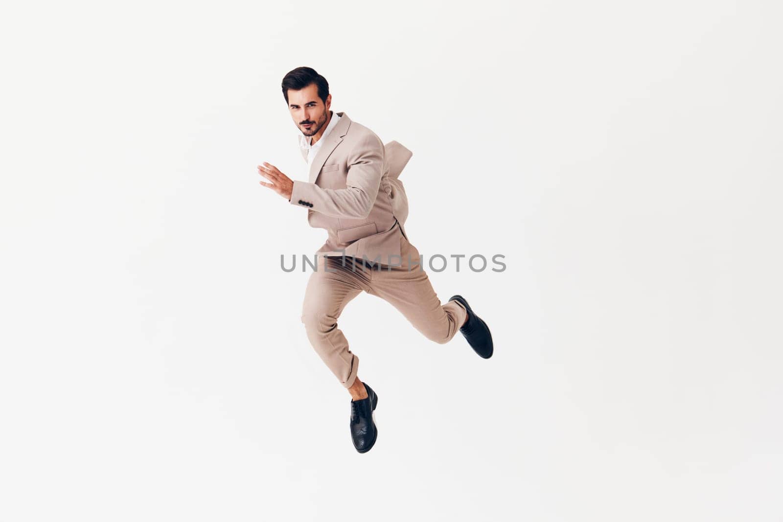 running man background winner smiling beige suit business businessman victory up happy by SHOTPRIME