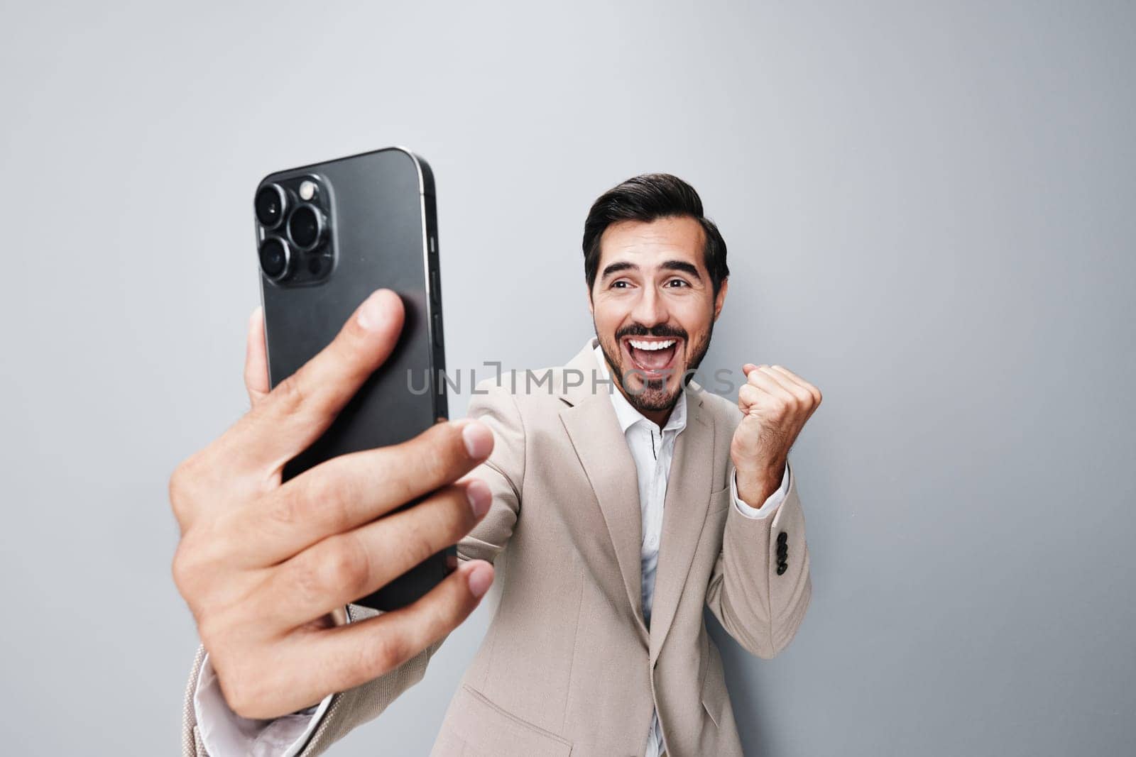 man hold business smartphone portrait phone call suit connection smile happy by SHOTPRIME