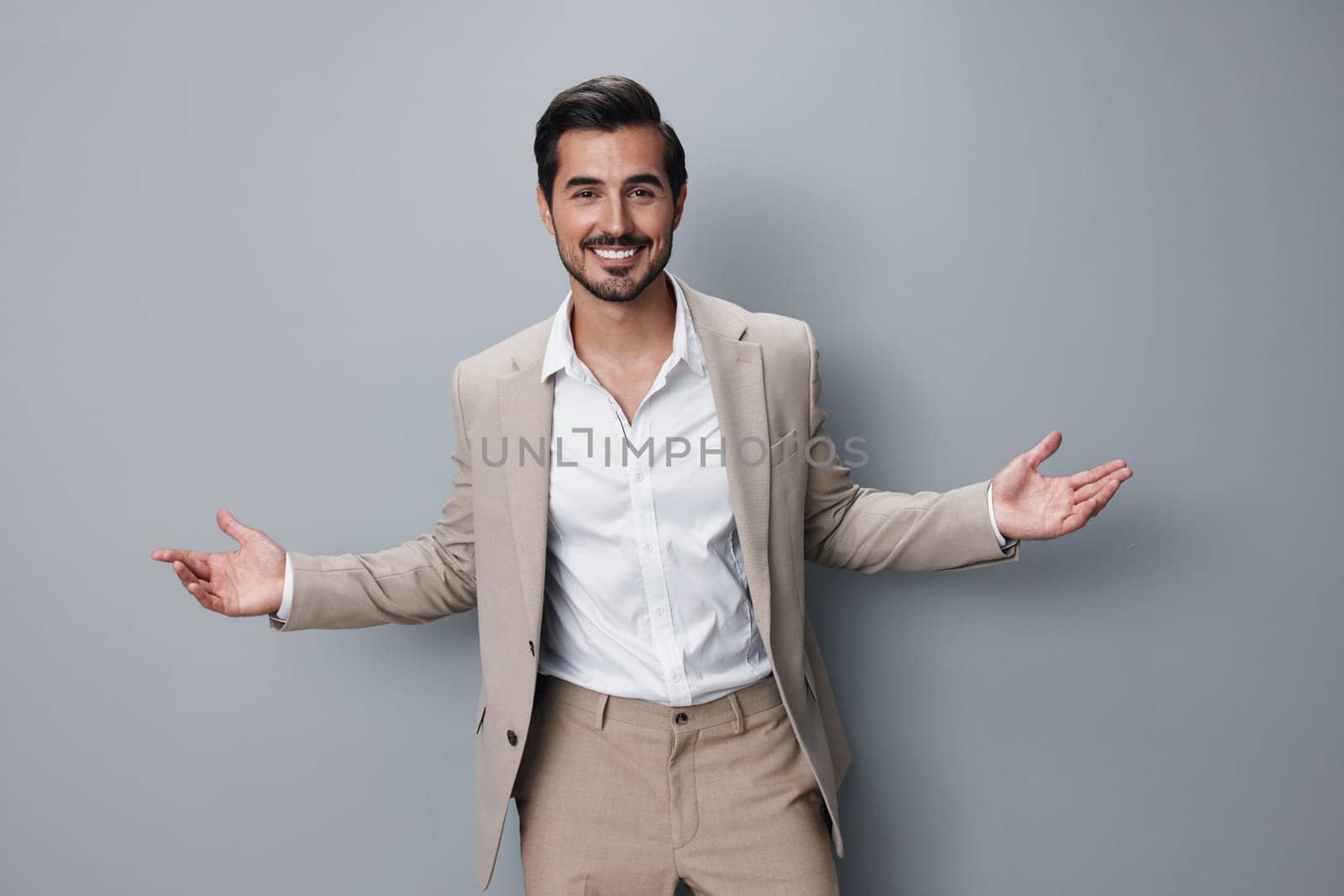 man businessman smiling smile beige copyspace business handsome portrait happy suit by SHOTPRIME