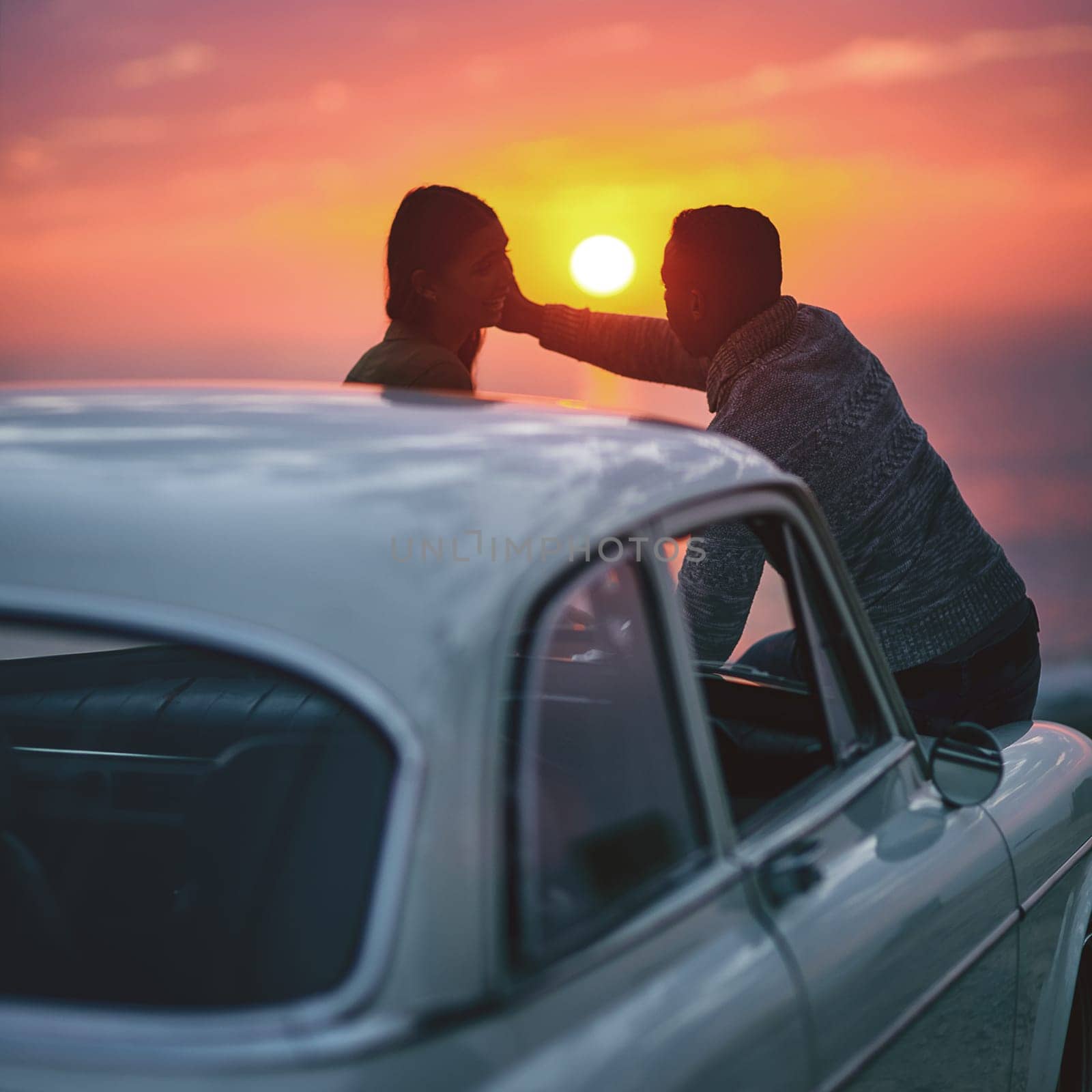 Youre even more beautiful than the sunset. a young couple making a stop at the beach while out on a road trip