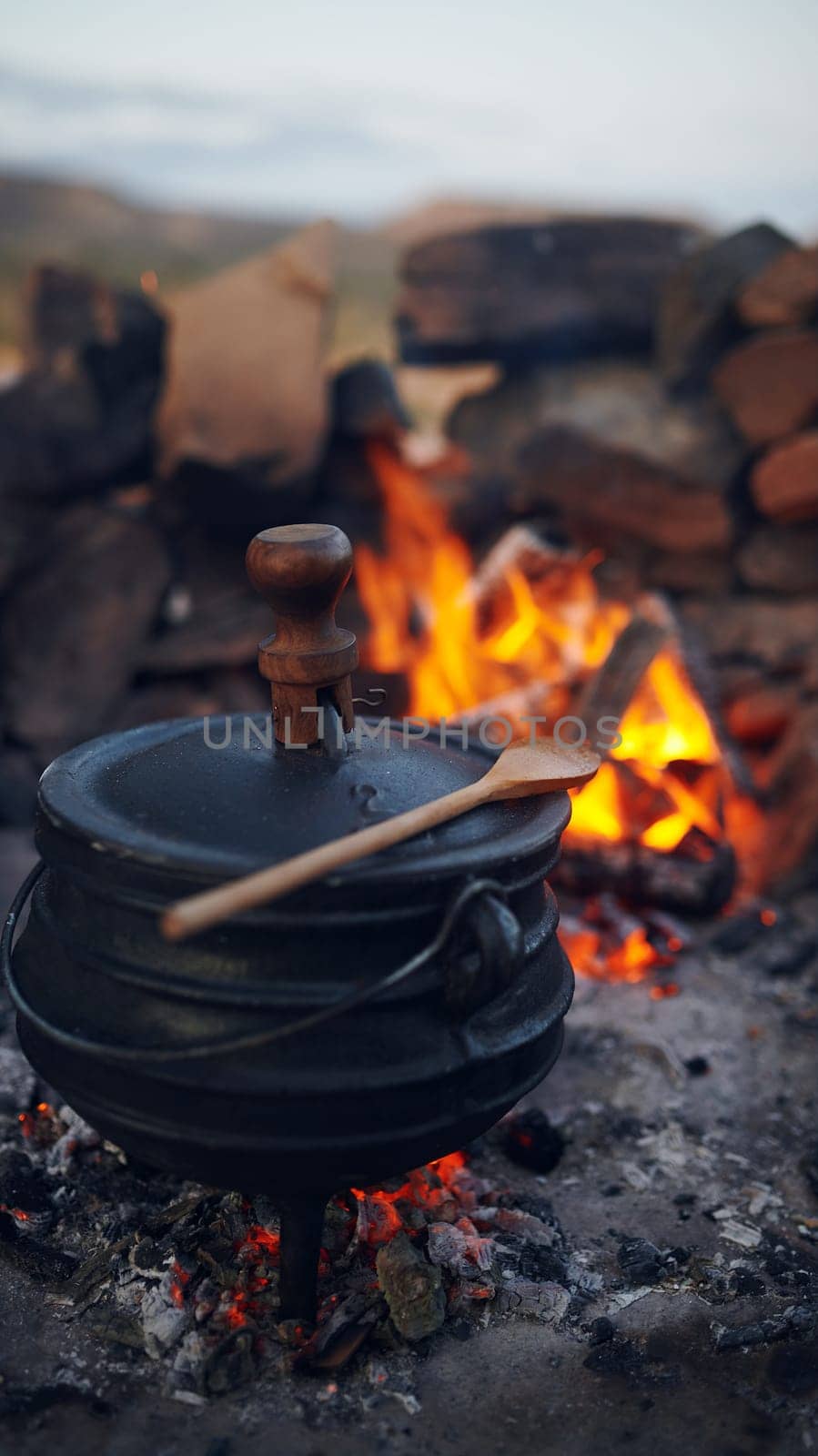 Say hello to tasty South African food. a traditional South African food being cooked by campfire outdoors. by YuriArcurs
