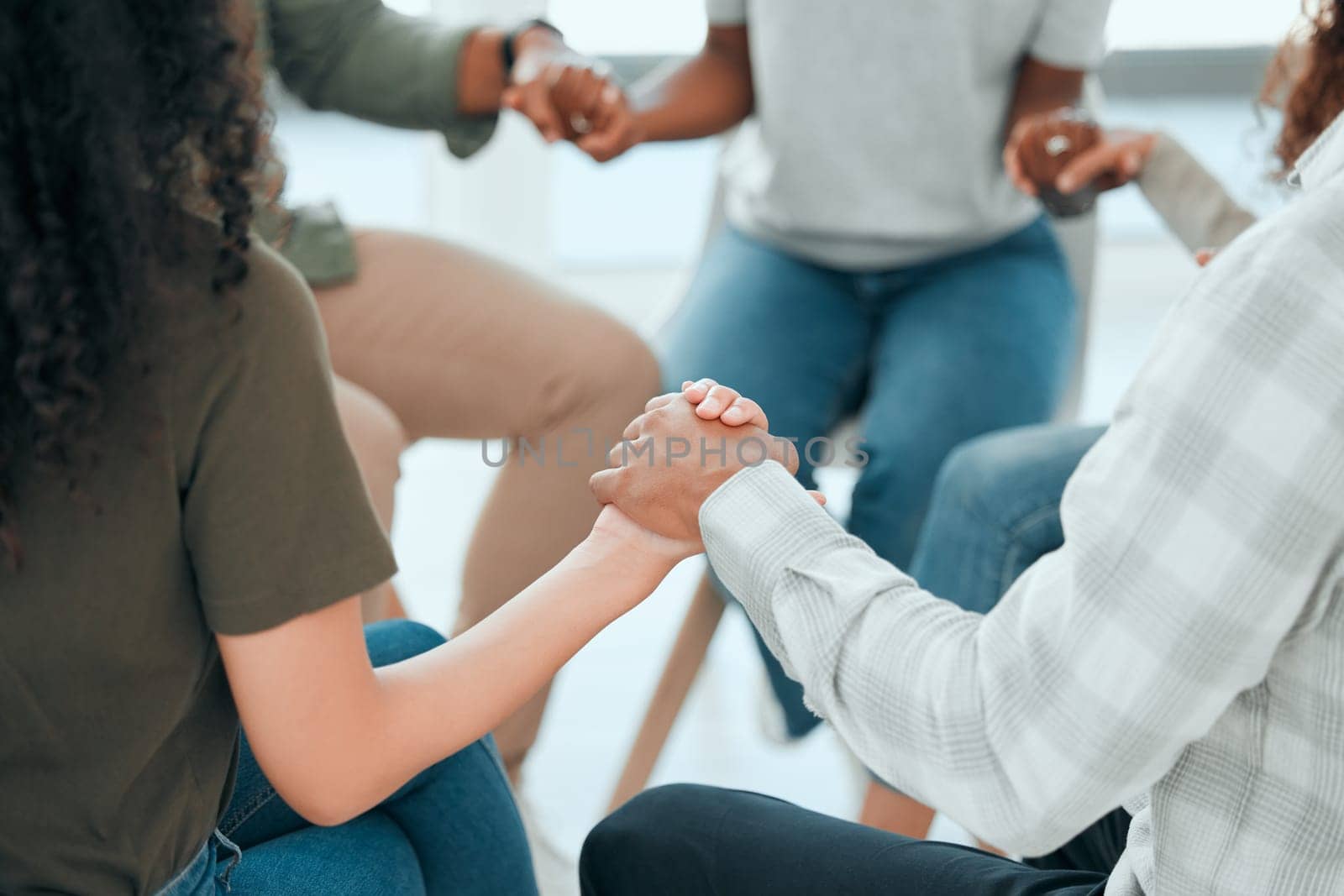 Circle, holding hands and support with praying in office for solidarity, faith and trust with religion at job. Men, woman and helping hand for prayer, team building and diversity with mindfulness by YuriArcurs