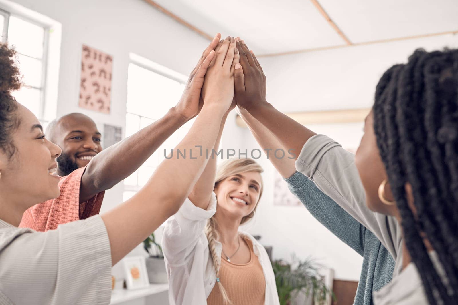 Teamwork, high five and group of business people with goal, support and collaboration at start up. Happy team, coworking and trust, hands together with smile, employees working with job cooperation