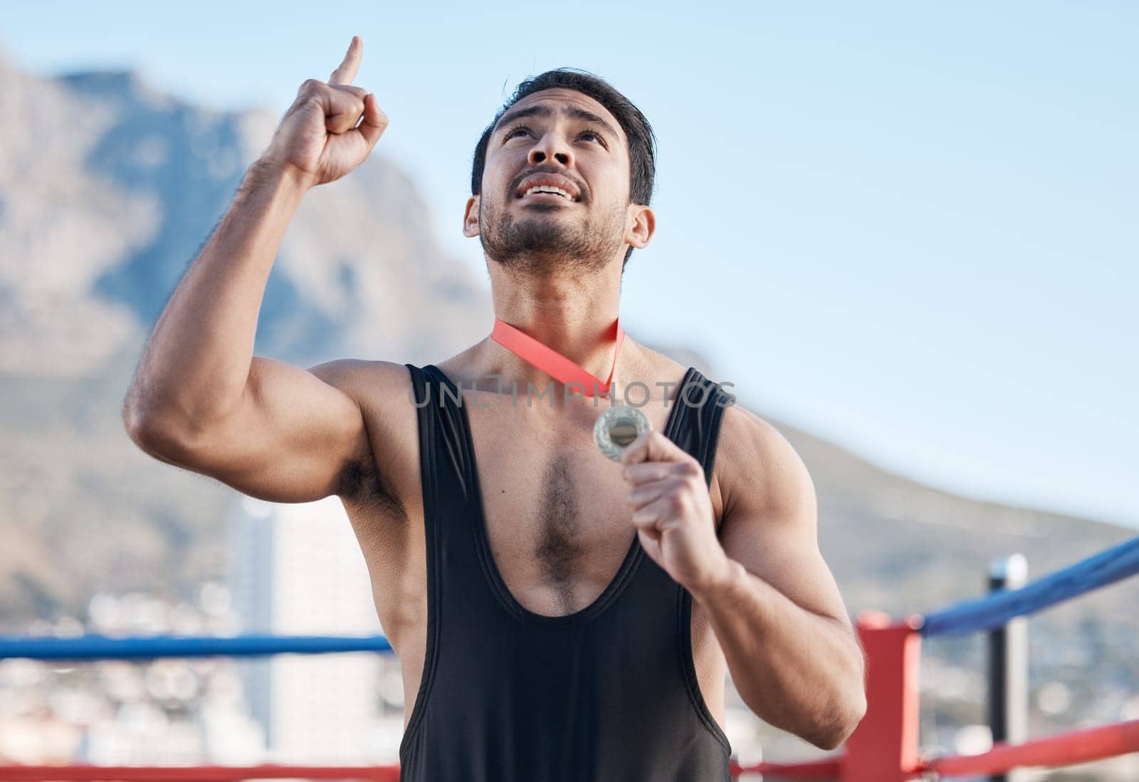 Winning, boxing medal and a man with thanks to God, celebration and sports gratitude. Success, young and a boxer with pride and award from a sport competition and grateful to commitment of a prize.