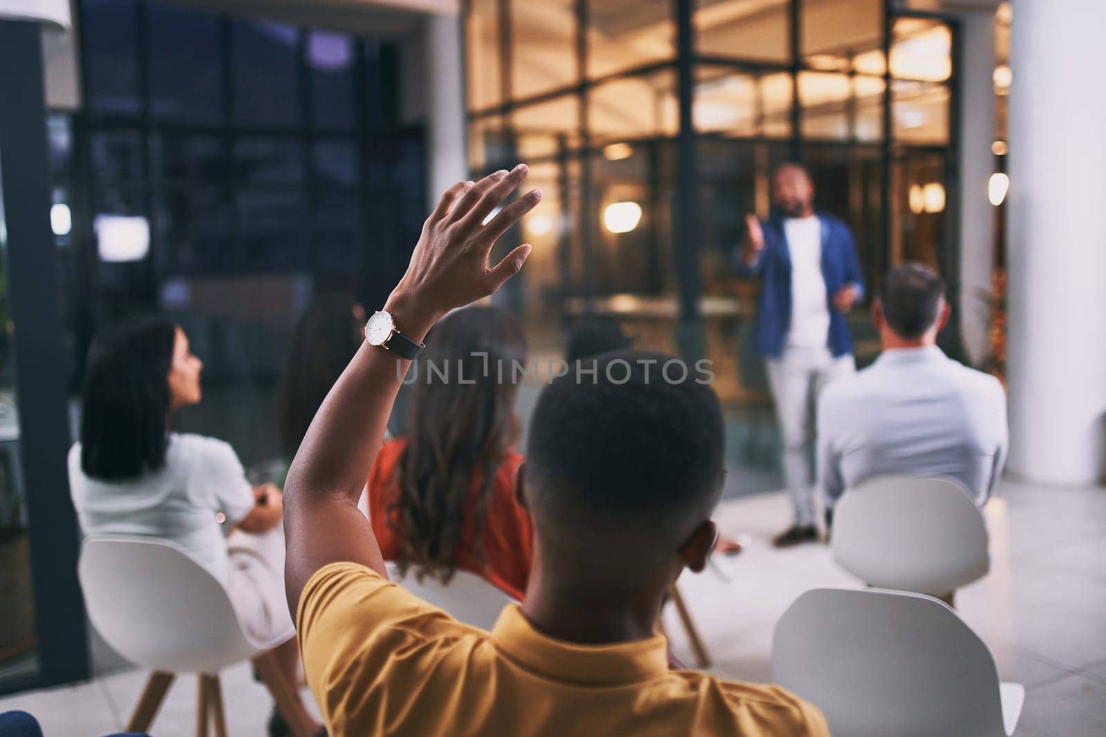 All questions are welcome. an unrecognizable businessperson raising their hand to ask a question during a conference at work