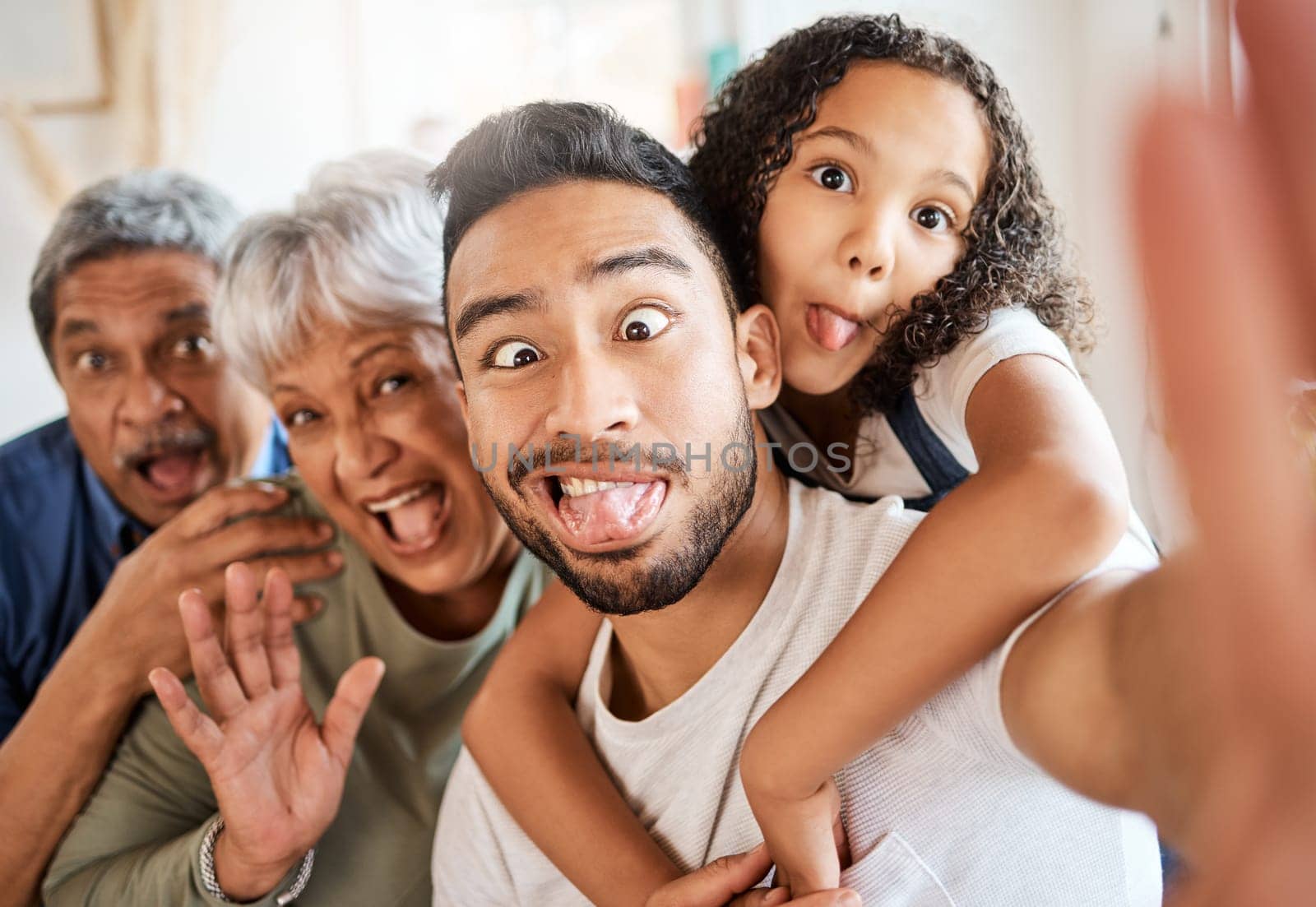 Happy family, portrait and silly face selfie for social media, vlog or funny online post at home. Grandparents, father and child with goofy expression for photo, memory or profile picture together.