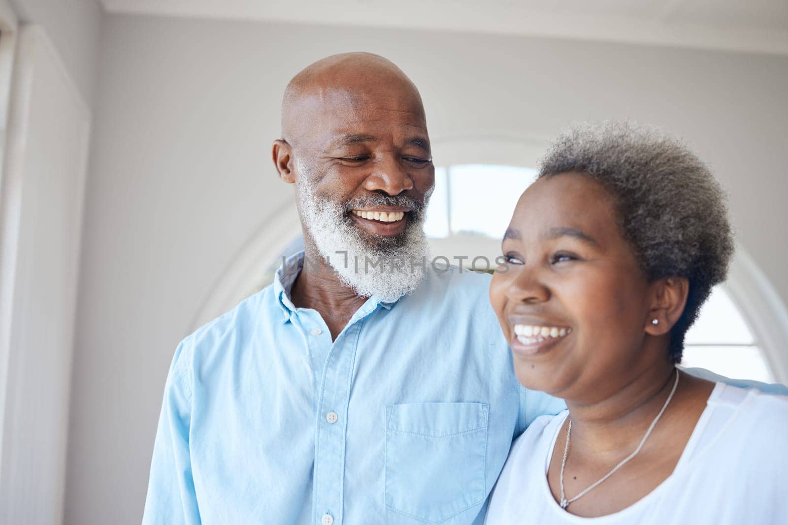 Senior black couple, smile and together in a happy home with love, care and commitment. Face of an african woman and man thinking about marriage, retirement lifestyle and happiness with a hug by YuriArcurs