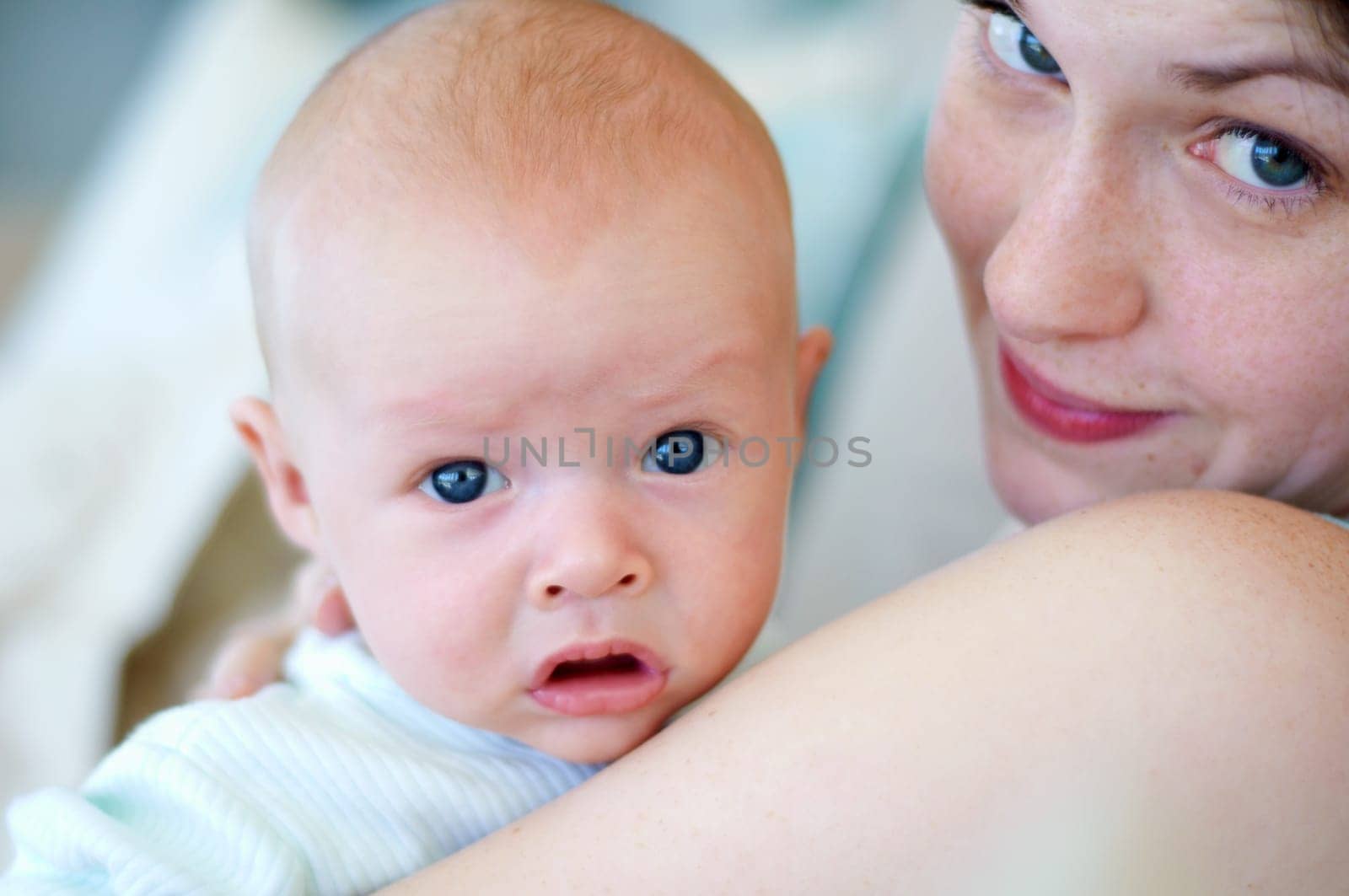 Kid, portrait and mom holding baby, bonding and care together in home. Face, child and mother carrying newborn, infant or young toddler, playing and enjoying quality time with love, family and happy