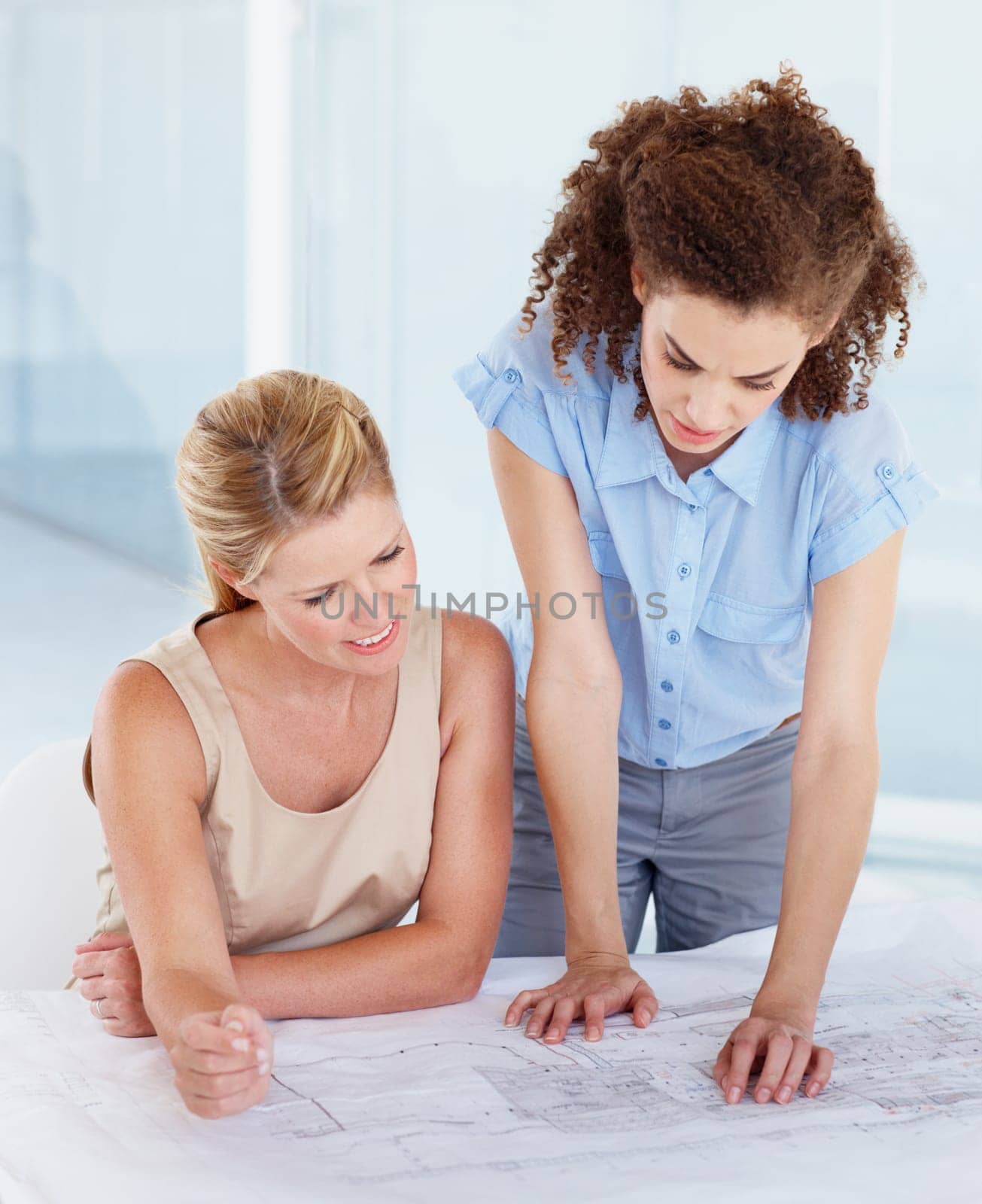 Confused business people, architect and blueprint in planning, strategy or brainstorming construction at office. Employee women working on architecture in doubt for project, document or floor plan.