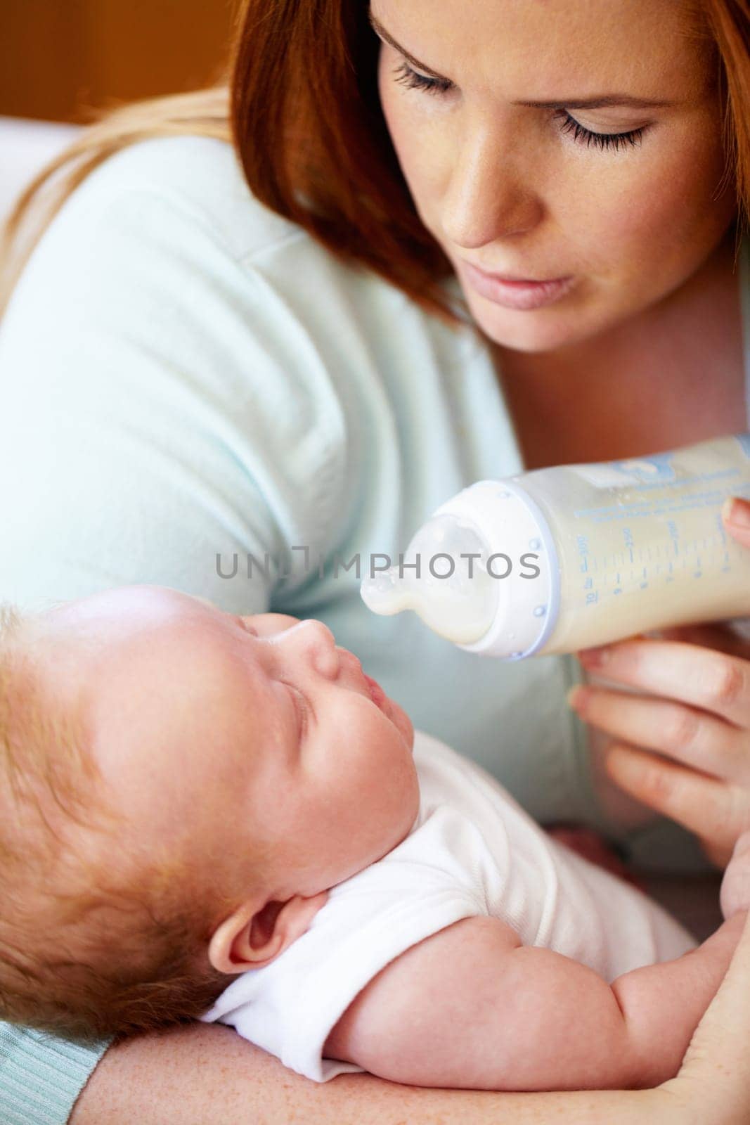 Mom, milk and feed baby from bottle for nutrition, healthy breakfast and diet in the morning. Mother, child and feeding newborn formula food for growth, development and wellness together in home
