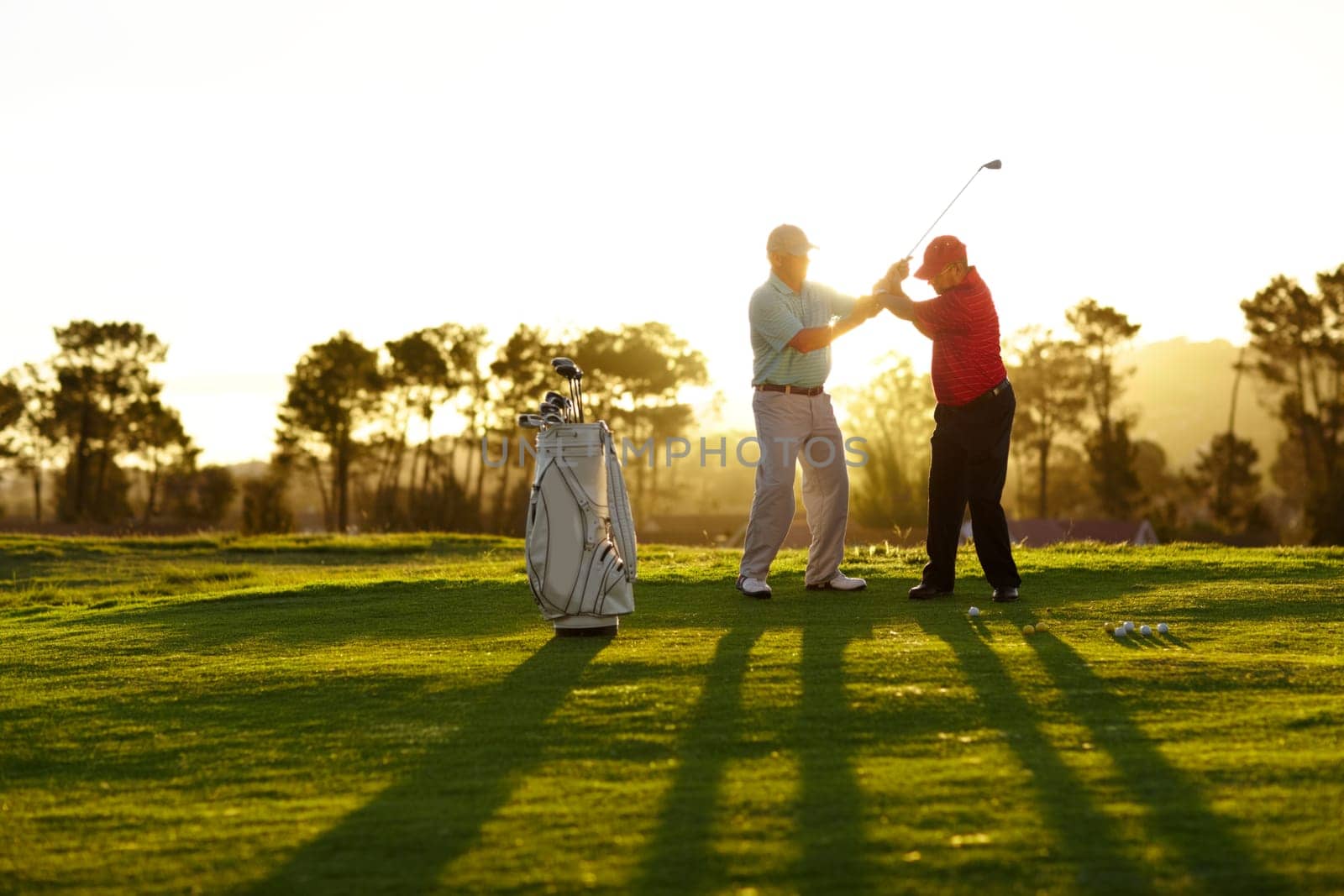Trainer, golf course or man with help, teaching or fitness with training, lesson or skills. Male person, player or coach with golfer, advice or sports with professional, physical activity or exercise.