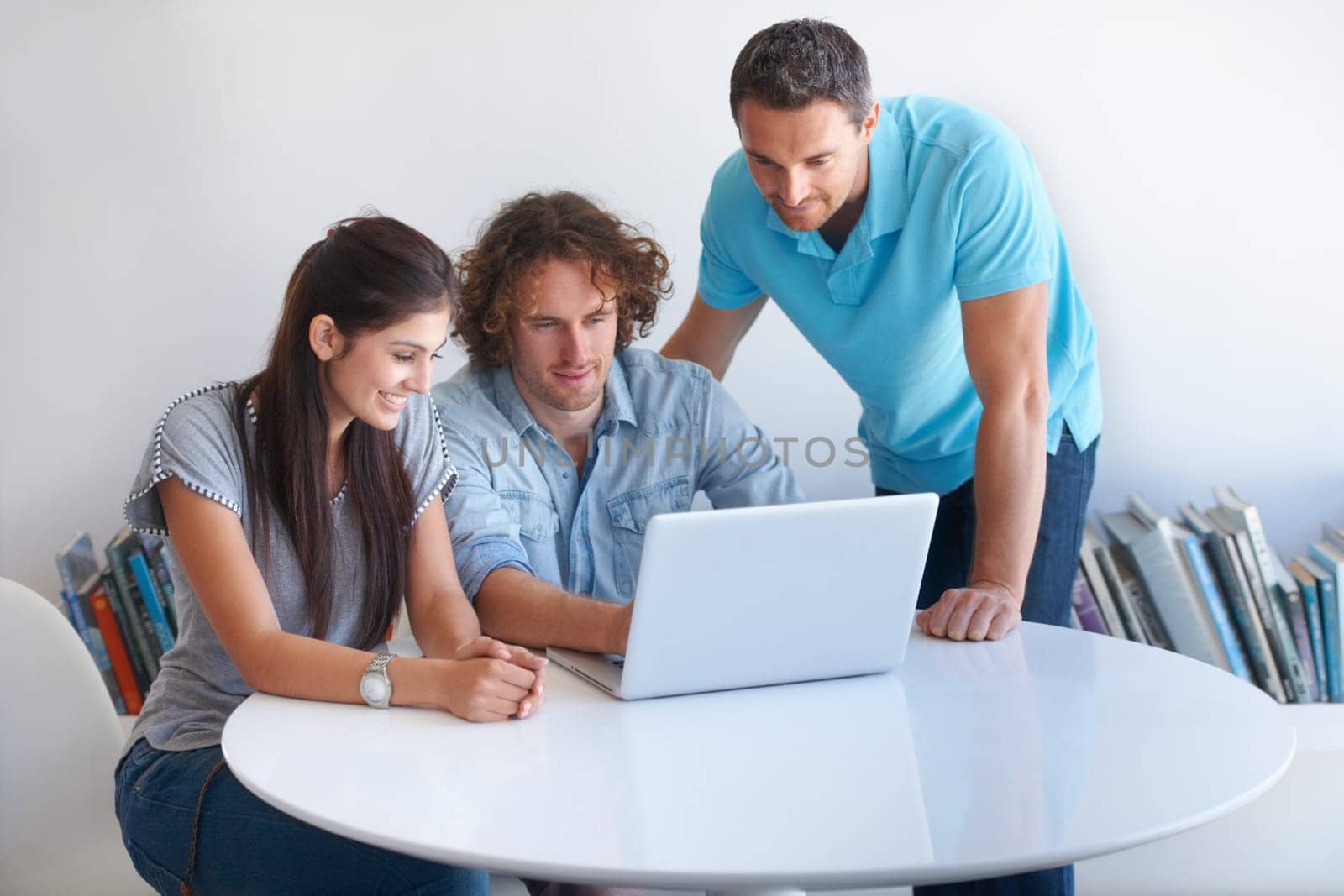 Laptop, teamwork and creative people in business startup, website design ideas and online solution. Collaboration, check and web designer team, woman and men talking, planning and review on computer.