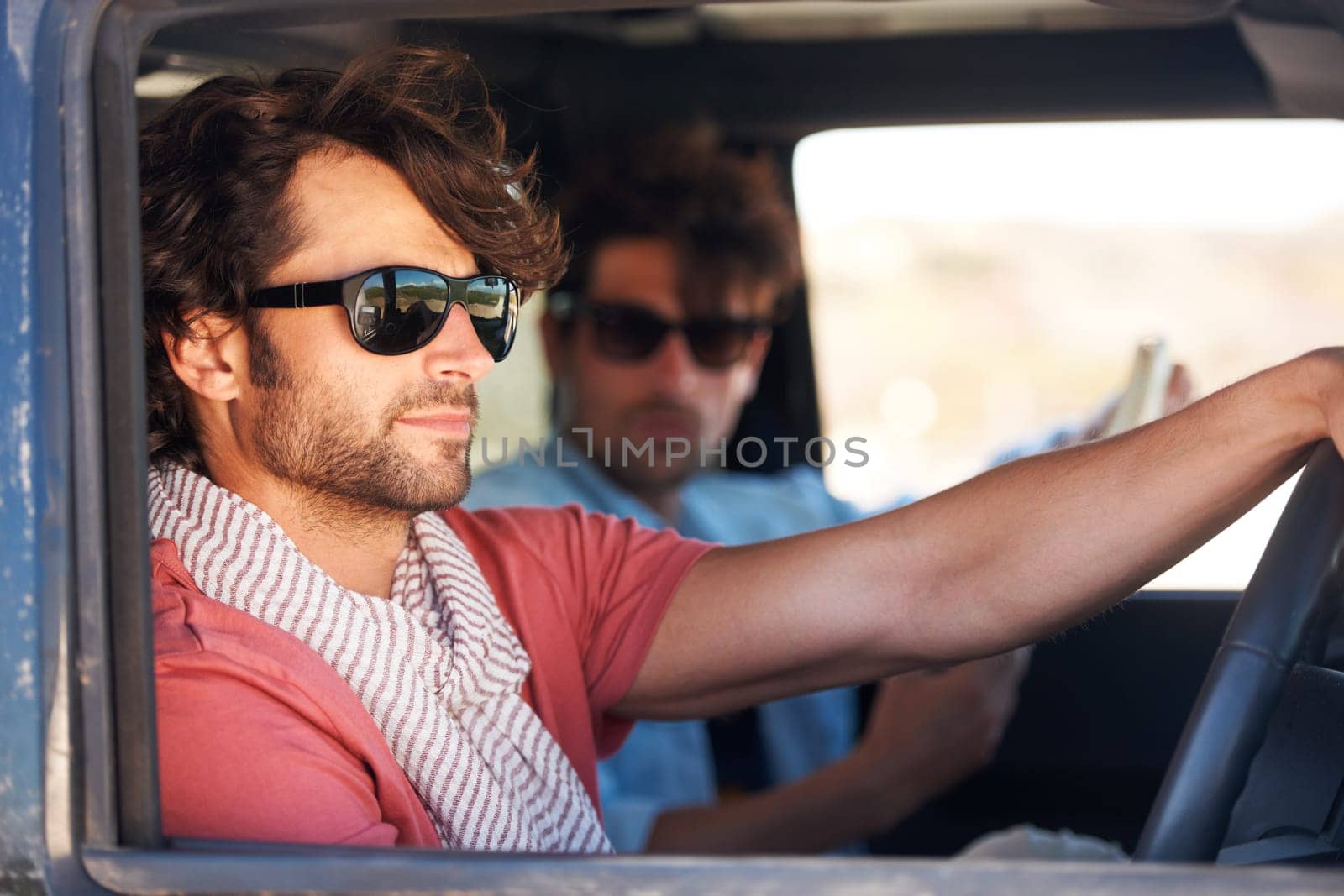 Road trip, driving and men for travel adventure, journey and holiday in summer, sunglasses and tourism. Driver, people or young friends for transport, car and conversation, talking and real vacation by YuriArcurs
