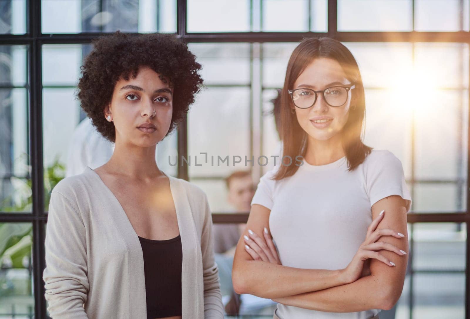 Businesswomen Having Informal Meeting In Modern Office