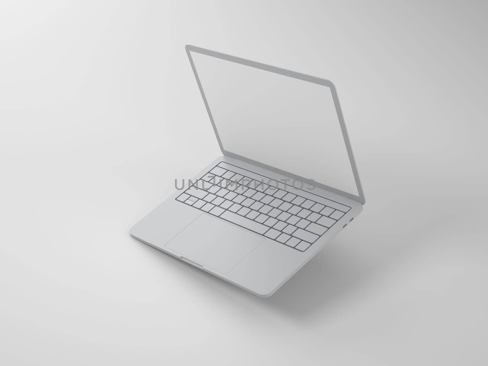 The raised top is an open thin gray laptop with a blank screen on a light background