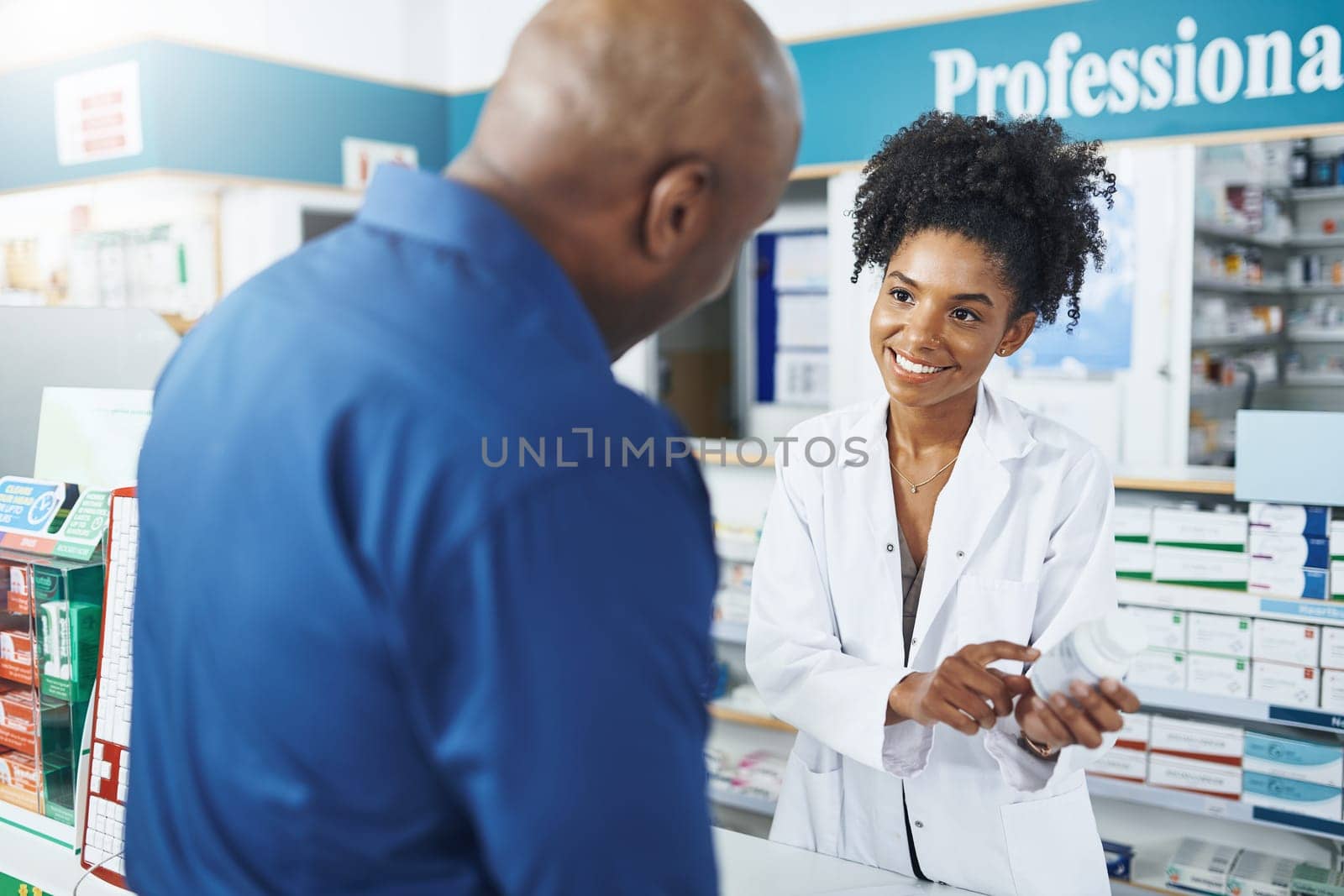 Its my job to make sure he takes it as per instructions. a female pharmacist assisting a customer in a drugstore