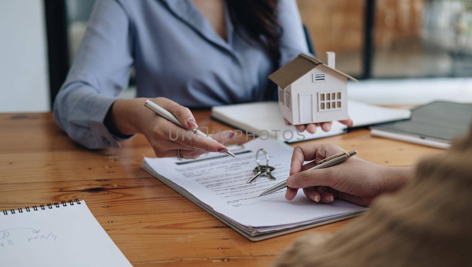 legal consultants, notary or justice lawyer discussing contract document on desk with client customer in courtroom office, business, justice law, insurance, legal service, buy and sell house concept by nateemee