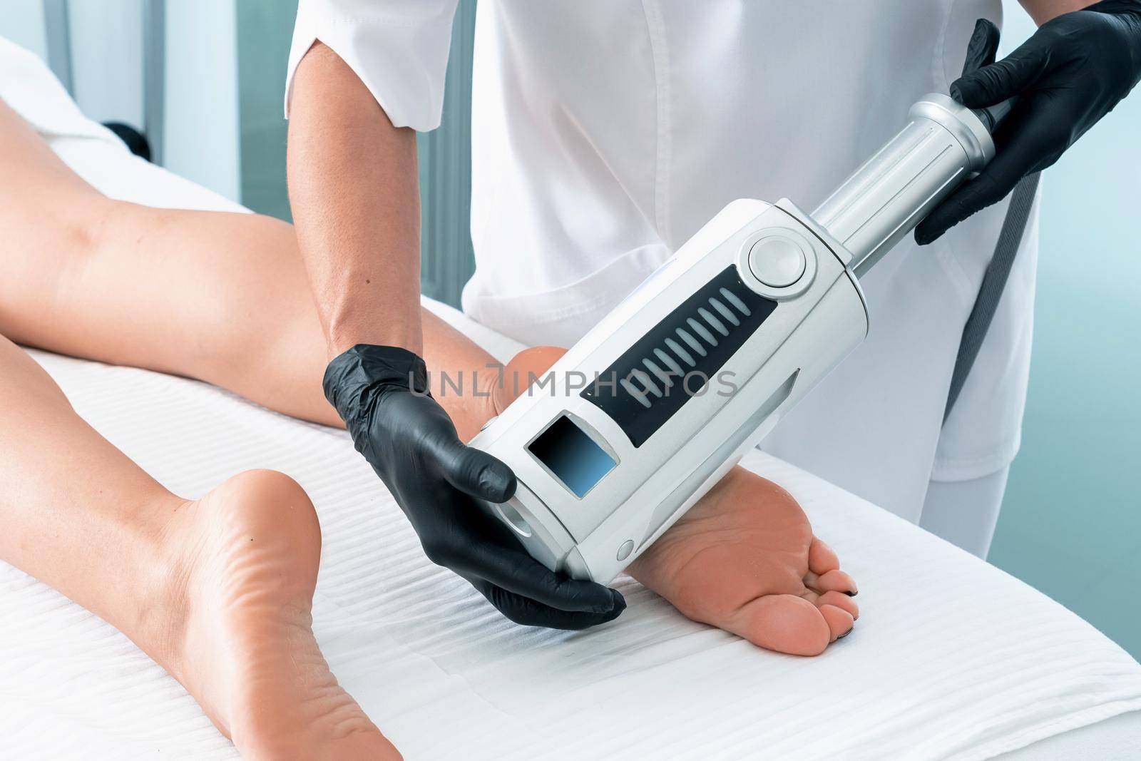 Partial view of cosmetologist in rubber gloves doing endospheres therapy