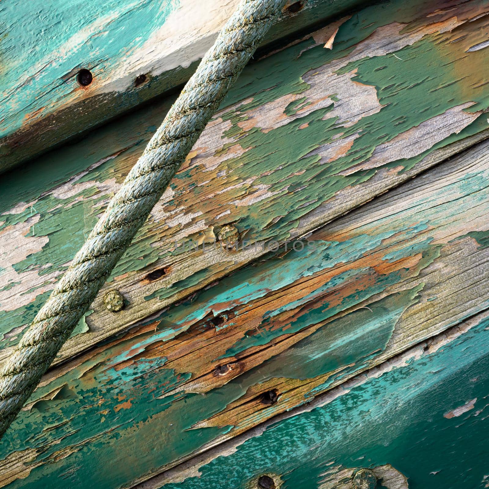 Old boat wooden hull, painting with green  cracks on wood texture