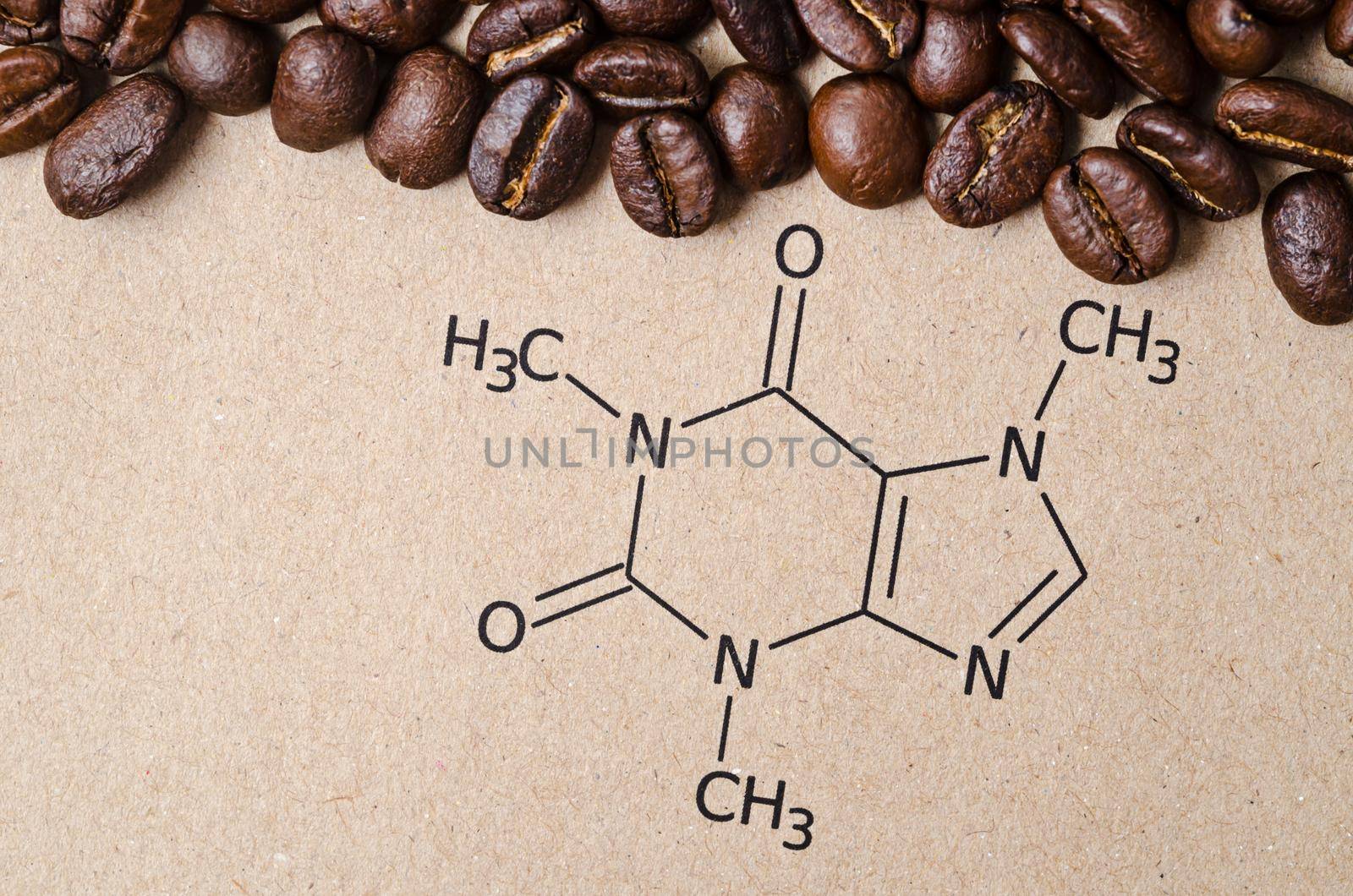 Structural chemical formula of caffeine molecule with roasted coffee beans. by Gamjai