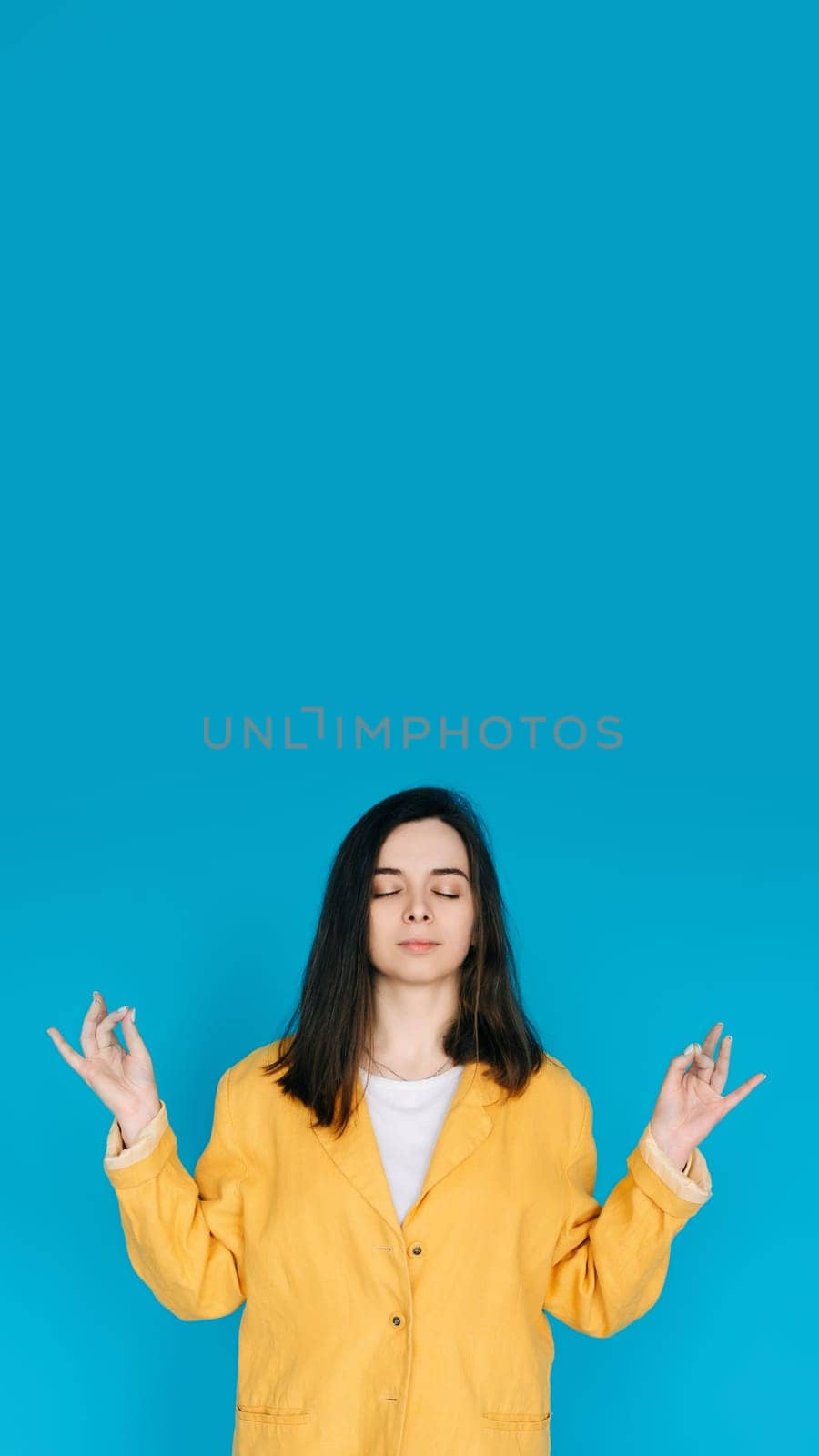 Serene Young Woman Practicing Yoga Meditation - Relaxation, Balance, Mindfulness, Serene Relaxation, Inner Peace, Mindfulness, Isolated on Blue Background.