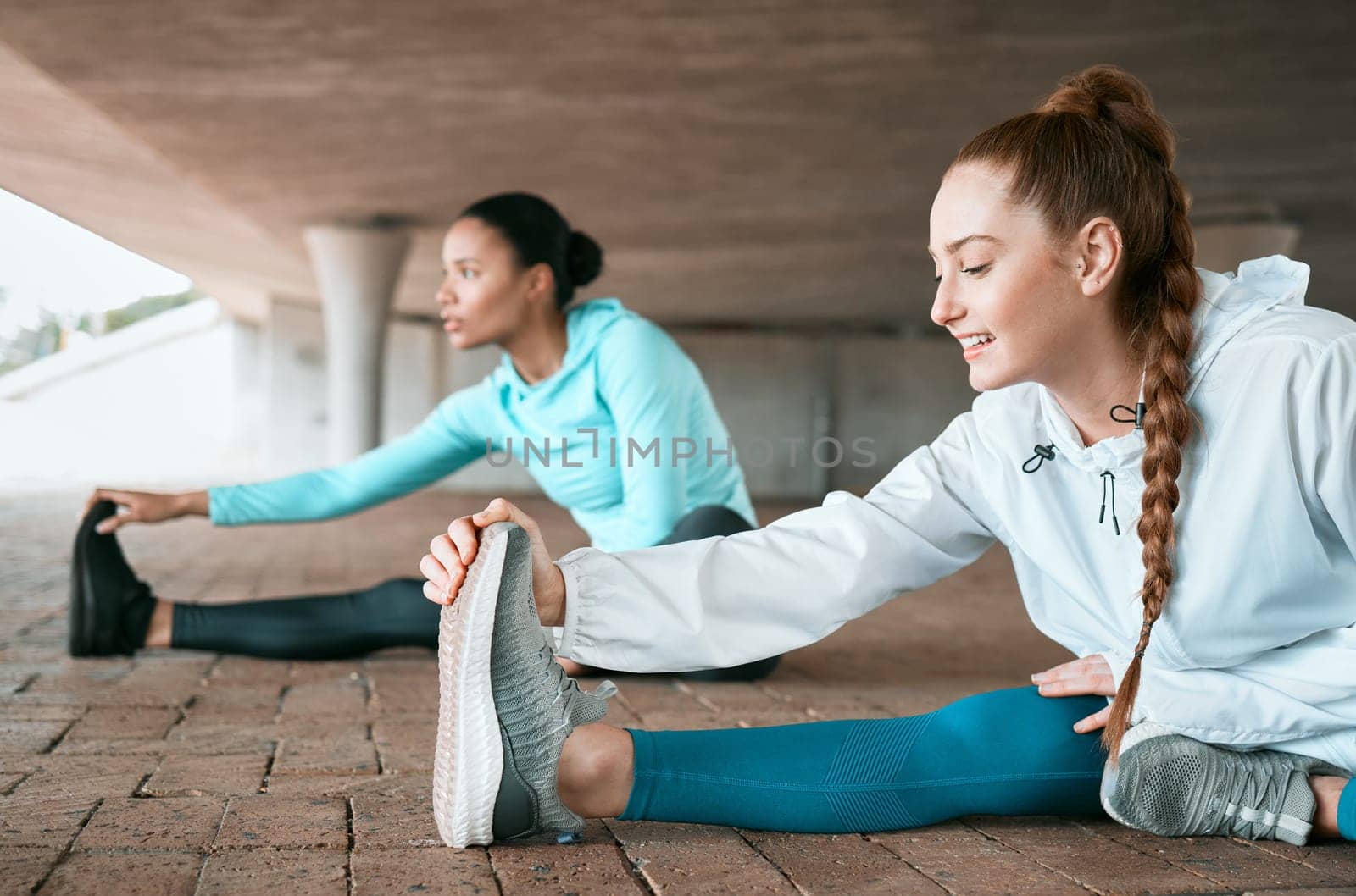 Friends, workout and people stretching as a fitness club for sports, health and wellness in an urban town together. Sport, commitment and friends training or team leg warm up for workout or run.