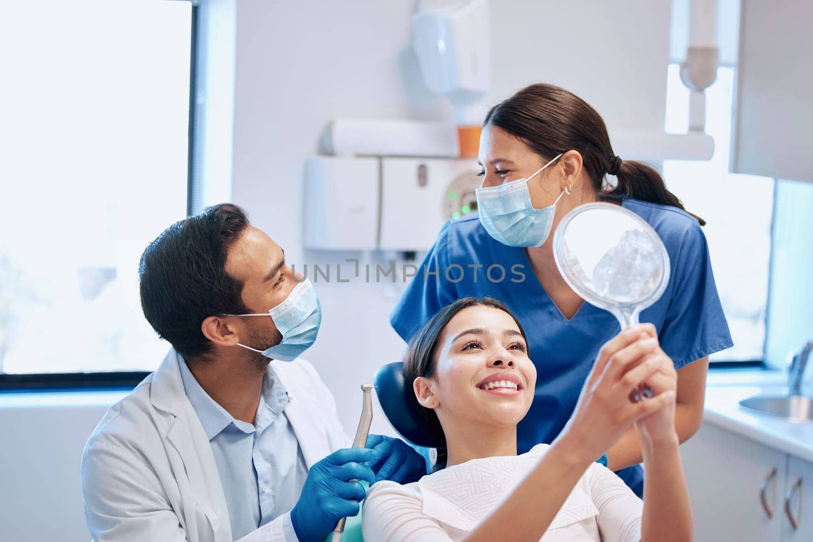 Dentist, mirror and woman with smile for teeth whitening, braces and dental consultation. Healthcare, dentistry and happy female patient with orthodontist for oral hygiene, wellness and cleaning.
