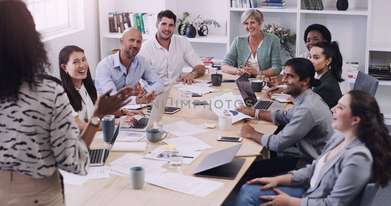 Businesspeople, presentation with leader planning and with laptop at desk in a office at their workplace. Teamwork or collaboration, business meeting and colleagues discussing together in a boardroom.