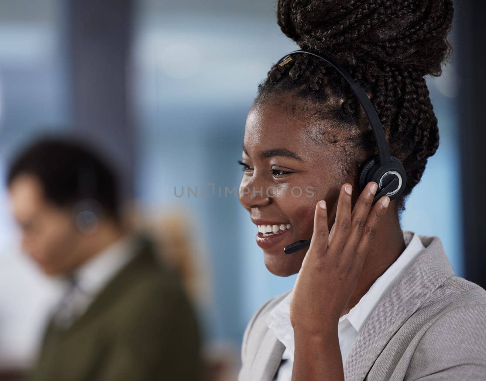 Callcenter, consultant and phone call, black woman with smile, communication and help desk agent in office. Telemarketing, crm and happy African girl in headset at customer service or contact center