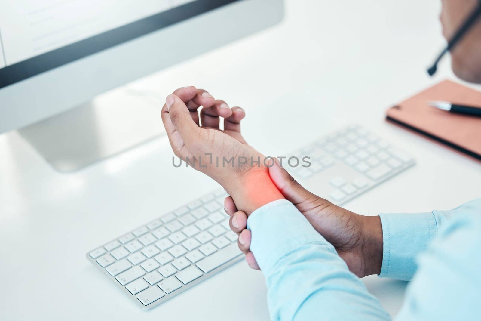 Businessman, hands injury or office carpal tunnel by computer in call center, contact us or customer support company. Wrist pain, stress or technology muscle tension abstract for telemarketing worker by YuriArcurs