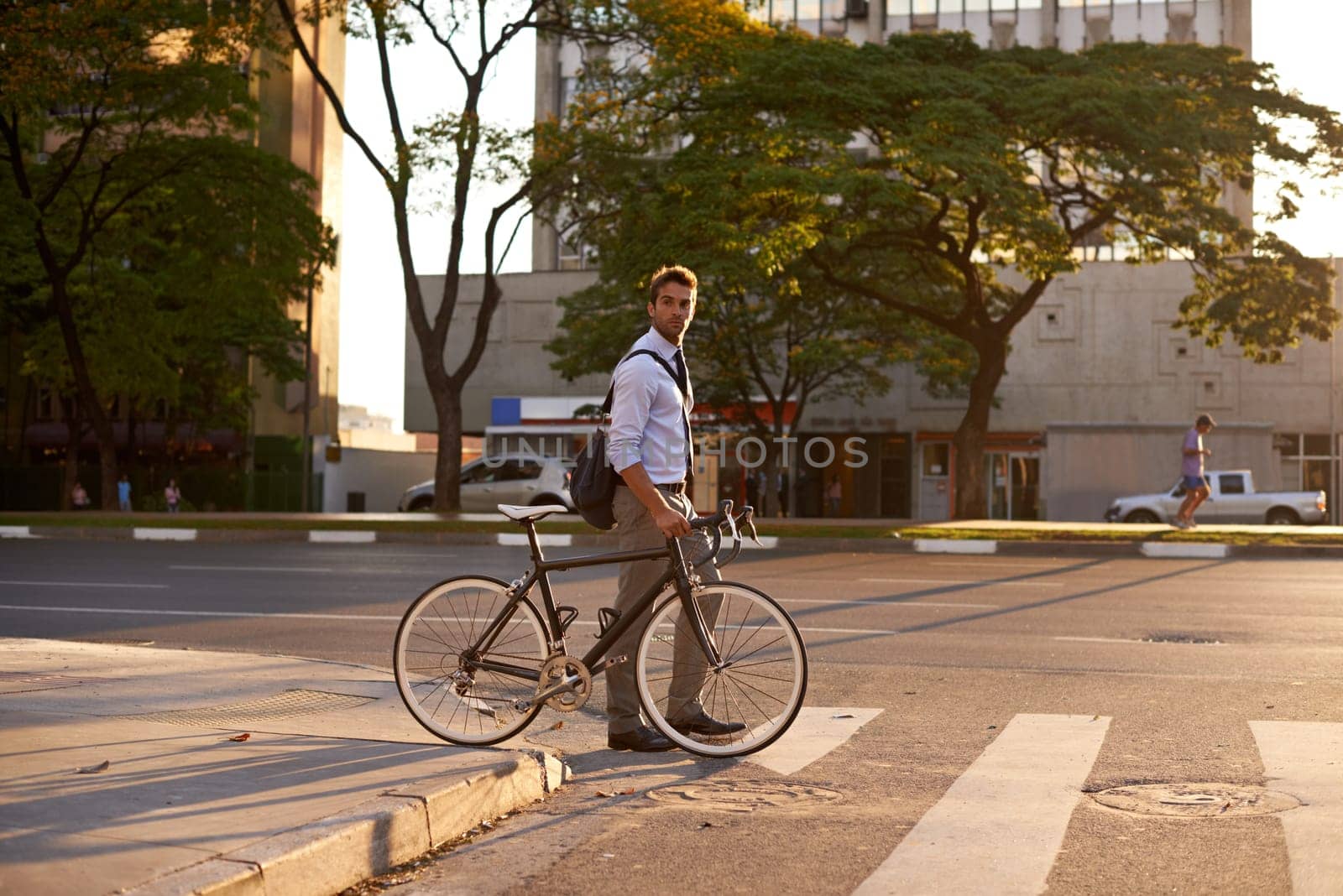 Crosswalk, bike and business man in city for morning, sustainable travel and carbon footprint. Cycling, transportation and urban with employee walking on commute for journey, transit and professional.