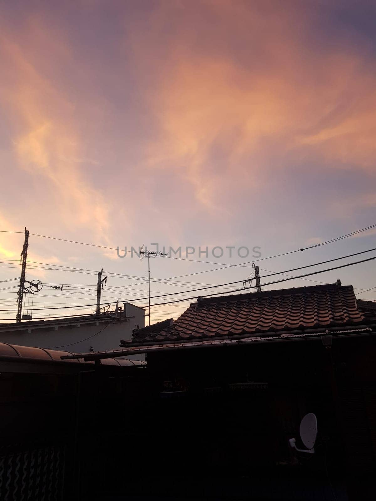 sky,afterglow,atmosphere,dusk,electricity,building,cloud,horizon,architecture,evening,photography,roof,vehicle