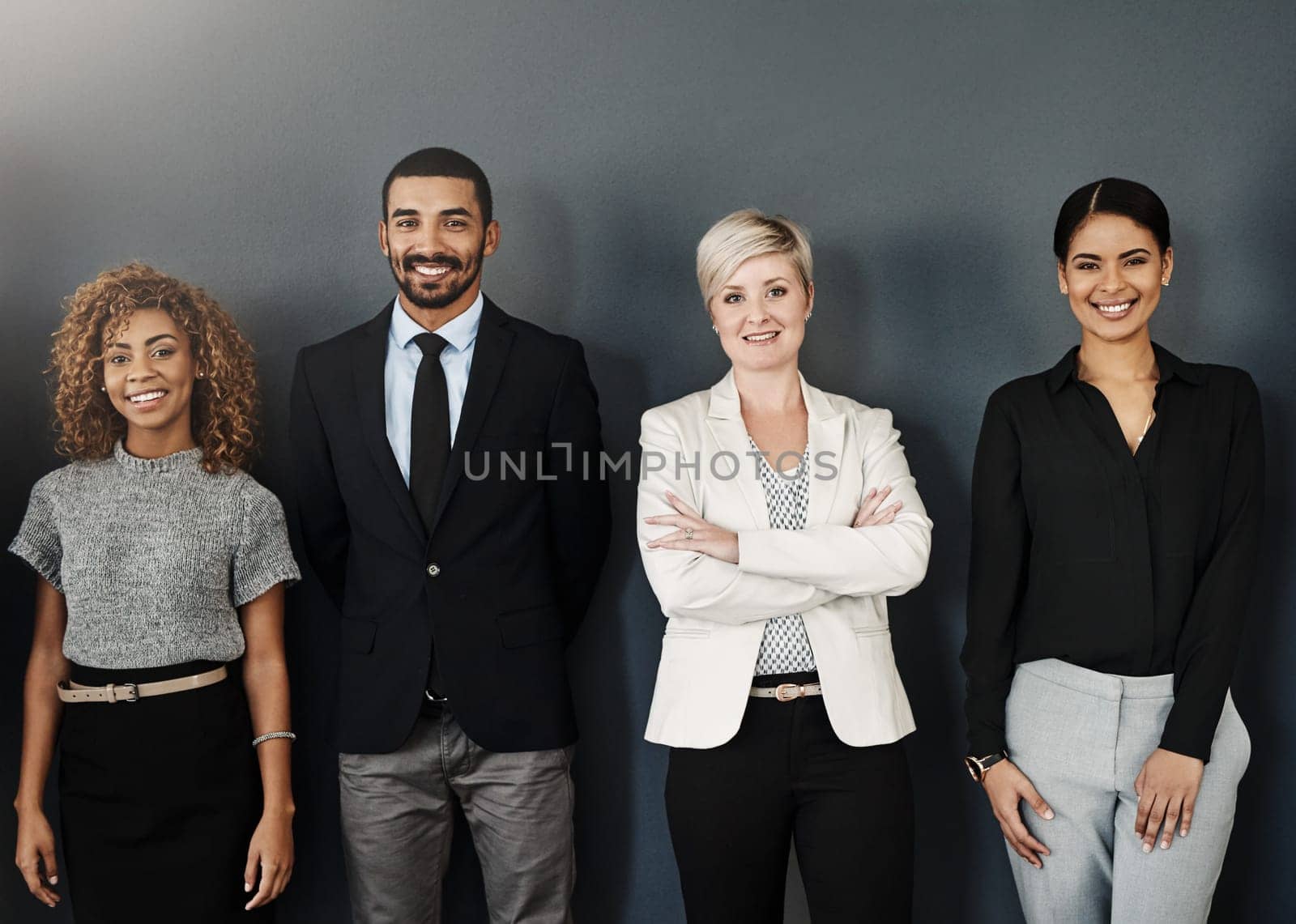 Diversity, support and portrait of business people in studio for smile, community and teamwork. Happy, collaboration and professional with employees and wall background for confidence and mission.