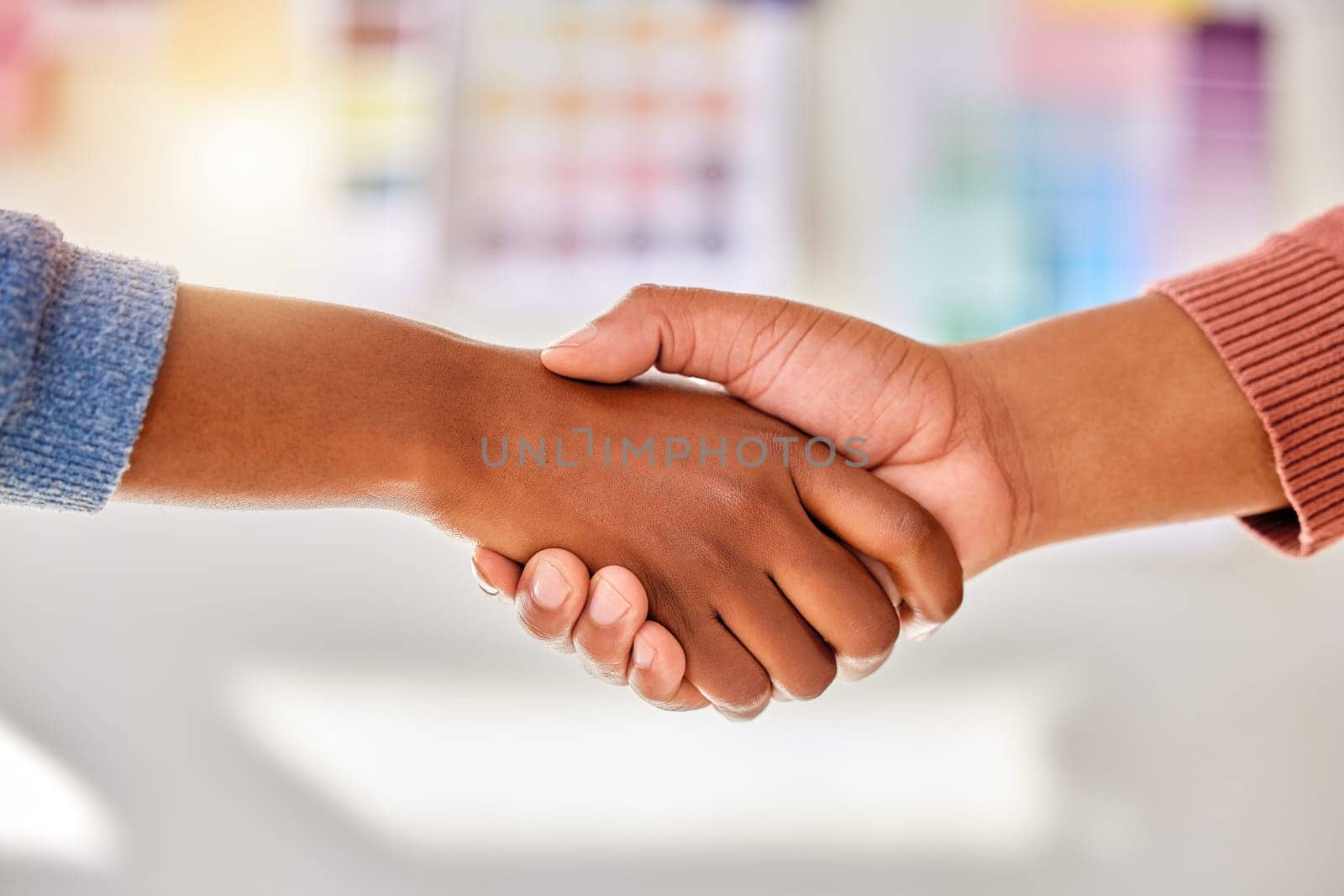 Closeup, business and handshake for support, collaboration and partnership for new project. Zoom, hand and employees with gesture for solidarity, creative and trust for leadership, skills or deadline.