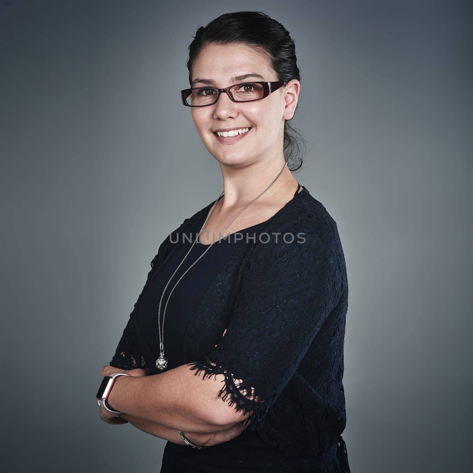 Hard work is the key to success. Studio portrait of a confident young businesswoman posing against a grey background