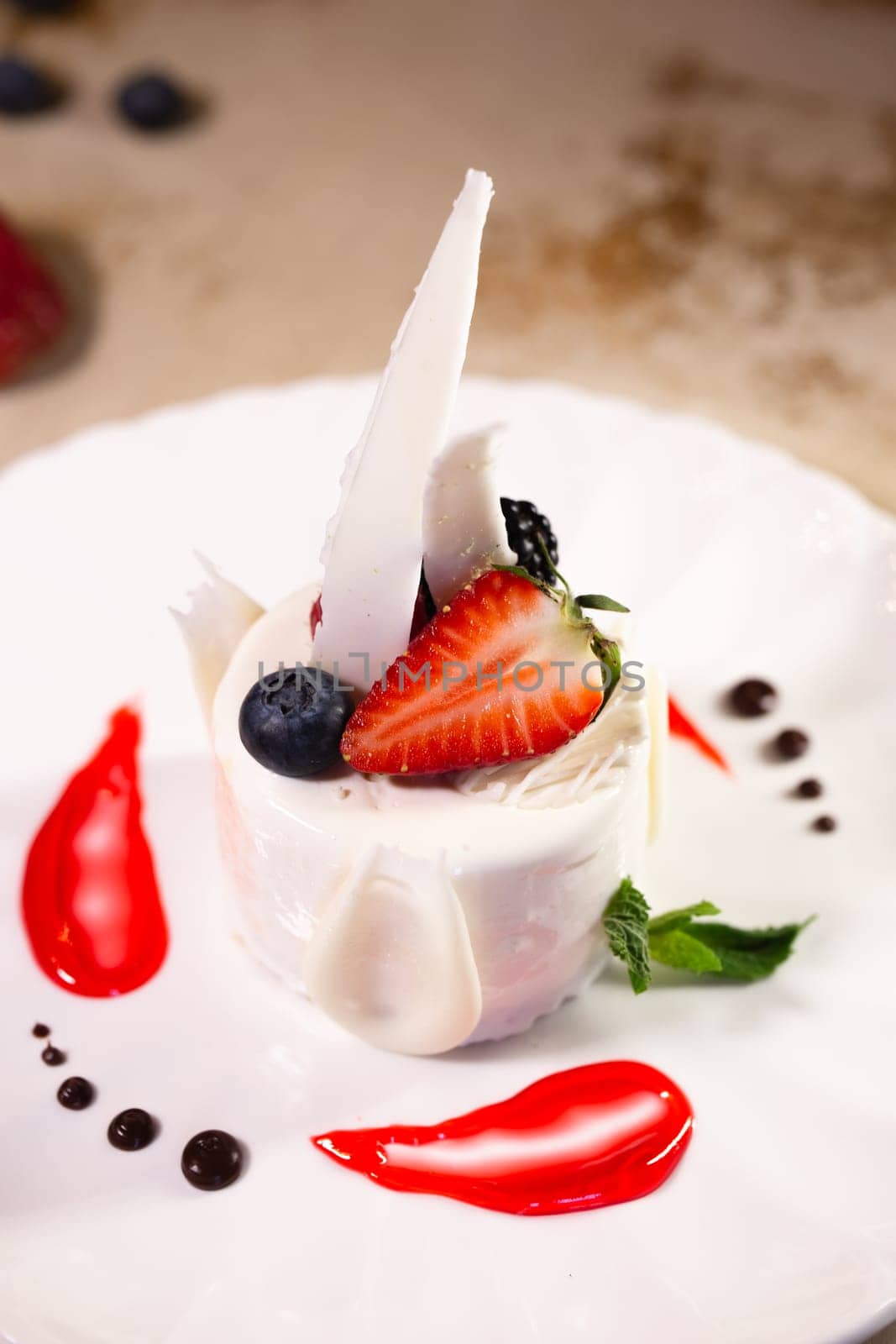 a beautiful fresh white dessert in a restaurant on the table. original dessert serving.