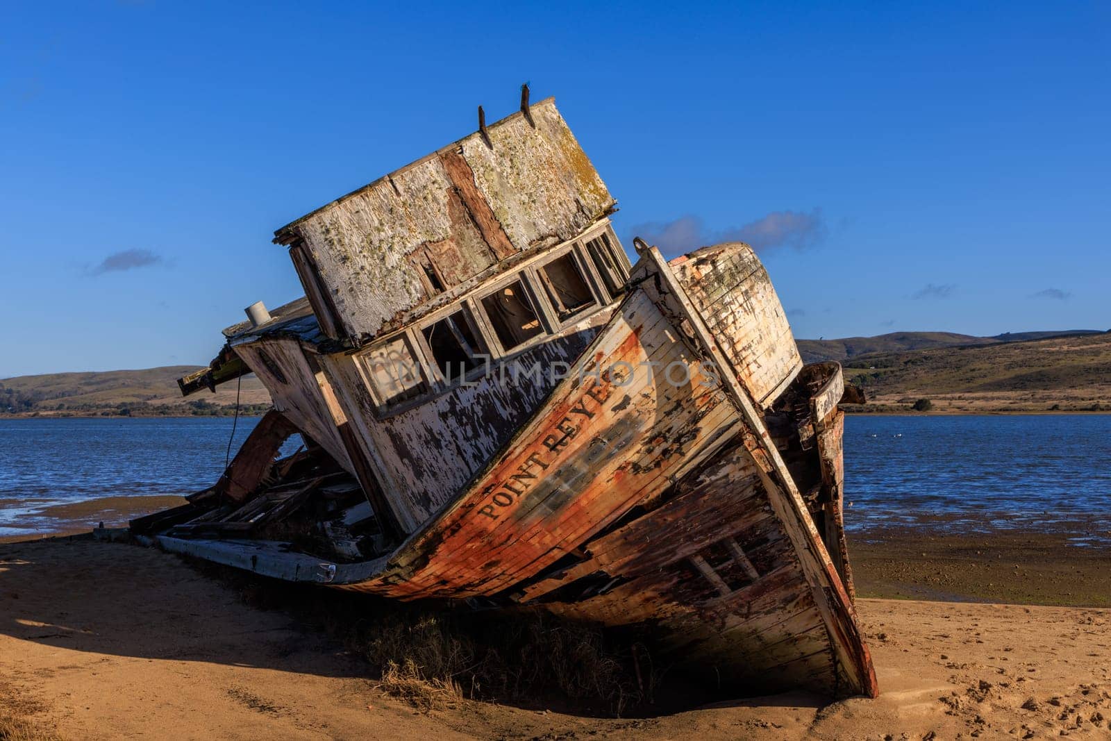 Old historic shipwreck on beach in Point Reyes, California on sunny day by Osaze