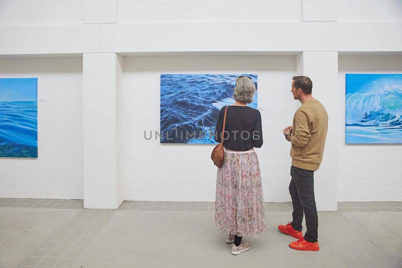 Skagen, Denmark, May, 2023: Visitors look at the paintings in the gallery